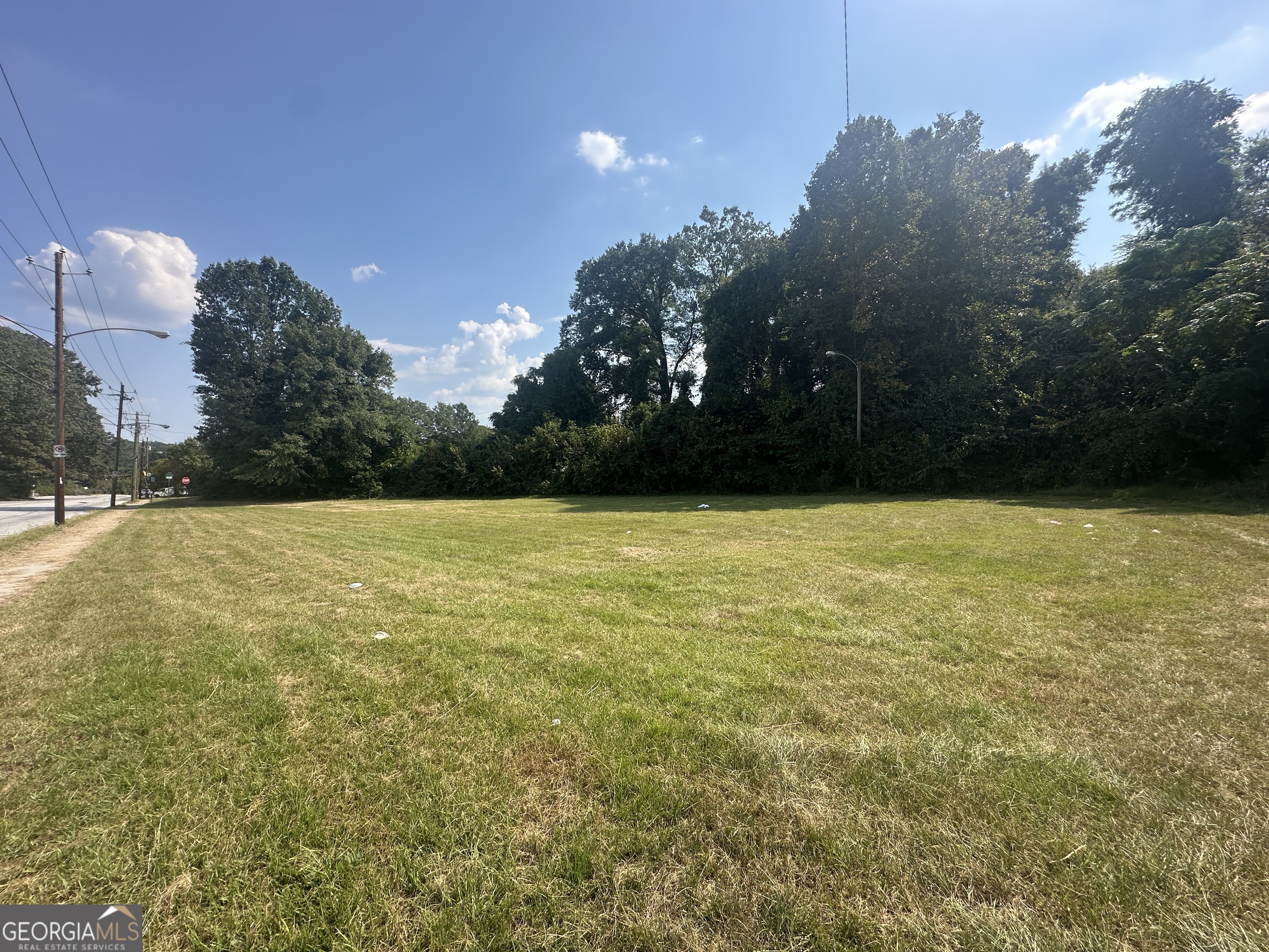 Prime Mixed Residential & Commercial Land Opportunity! This offering includes 3 contiguous lots located along Lakewood Way SW / Hilltop Drive SW - one zoned Commercial and two zoned Residential. The combined parcel features full street frontage, a curb, and generally flat terrain, giving a clean canvas for a wide range of possibilities. Public utilities are available. Large scale possibilities lie ahead: a builder sees potential for mixed use; whether for live/work, retail front with residences behind, or other configurations, this site offers excellent flexibility. As a point of reference, the property sits directly across the street from 109 Lakewood Way SW which is also available for sale.