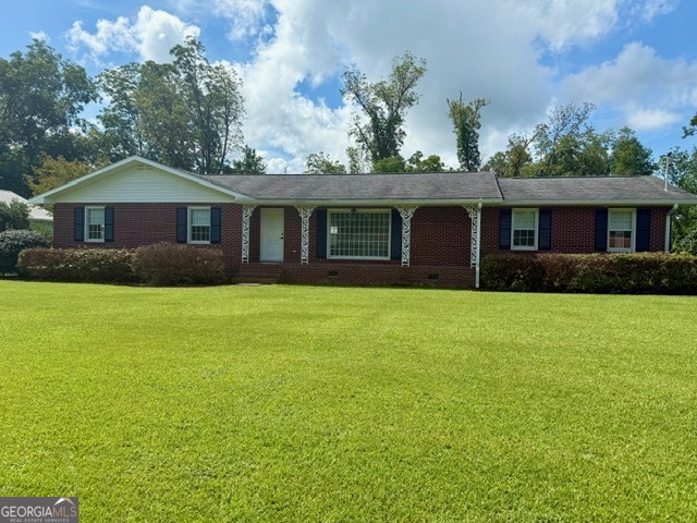 Classic ranch style brick home with beautiful large well kept yard, offering plenty of space for landscaping or outdoor activities. Home features large family room and living room is spacious with lots of natural light. Home features 3 bedrooms with 2 full bathrooms and a half bathroom under carport. This home has lots of space to offer and has large building in backyard. Call today to tour this great home!