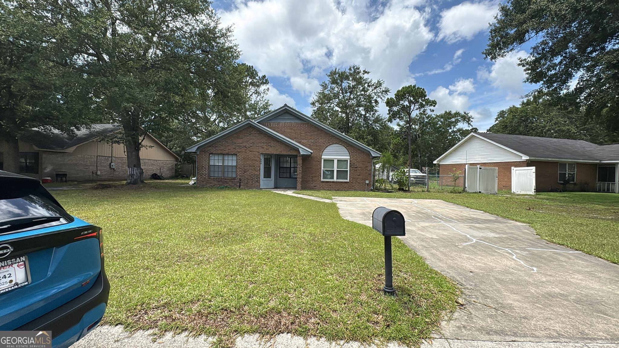This well-kept, all-brick 3-bedroom, 2-bath home offers comfort, durability, and a great layout in a quiet neighborhood of Hinesville. With 1,480 sq ft of living space, it's a dream for first-time buyers, families, or investors looking for a solid property near Fort Stewart. Inside, you'll find a bright, open floor plan with plenty of natural light, tile flooring, and built-in shelving for extra storage. The sliding glass door opens to a fenced backyard with a storage shed - perfect for gardening, pets, or weekend gatherings. This home is truly move-in ready and priced to sell. Enjoy easy access to schools, shopping, dining, and all the conveniences Hinesville has to offer.