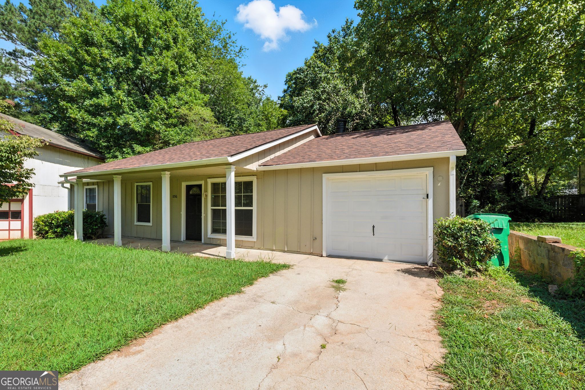 Welcome to this charming 3-bedroom, 2-bath home nestled in a quiet cul-de-sac in Stone Mountain. This well-maintained ranch features a spacious living room with a cozy fireplace and an eat-in kitchen perfect for family meals. The primary suite offers ample space and natural light, while the secondary bedrooms could have multiple uses. Enjoy the large, level backyard-great for relaxing or entertaining. The home includes an attached garage and sits in a wonderful community! Conveniently located near shopping and parks this is an ideal place to call home.