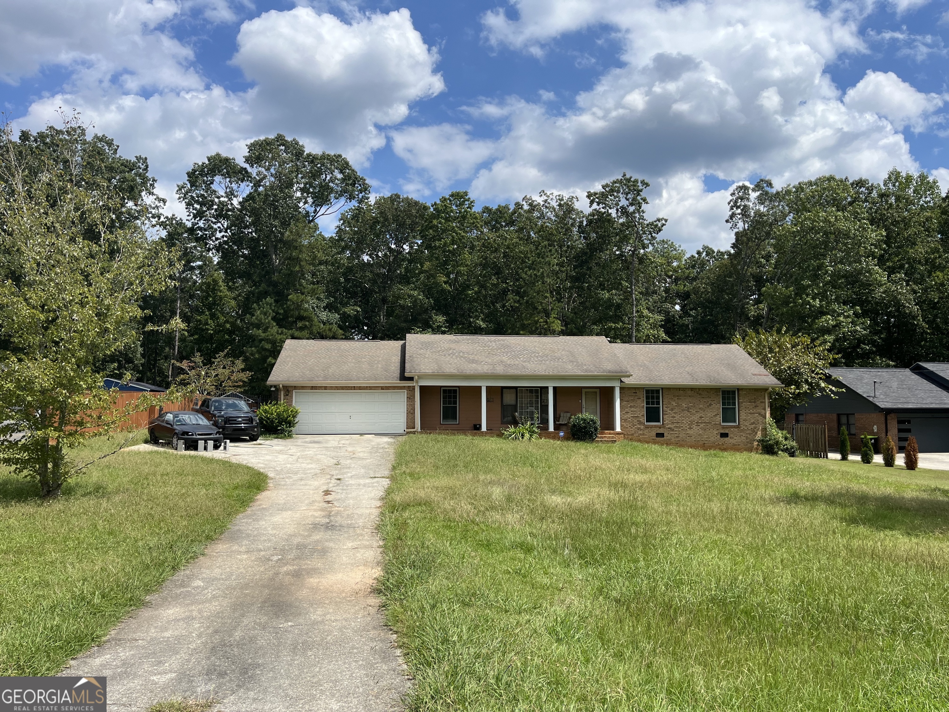 This probate sale offers a clear title and a motivated seller, making it a great opportunity. The ranch-style home features three bedrooms and two full baths and requires very little TLC to truly shine. Inside, you'll find upgraded countertops with a kitchen island, tiled bathrooms, and a spacious family room. The property sits on two acres, with a spacious front and back yard, perfect for entertaining, a deck and a sun room. Located in an up-and-coming area with access to Fayette County schools, shopping and more. This home is ideal for families, investors, or anyone looking for a property with great potential. Agents please refer to the private remarks before scheduling a showing.