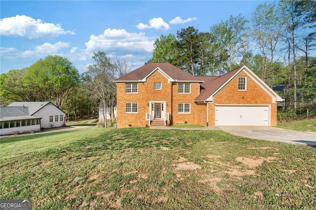 Photo of 835 Lockriver Way, Lawrenceville, GA 30044 (MLS # 10727359)