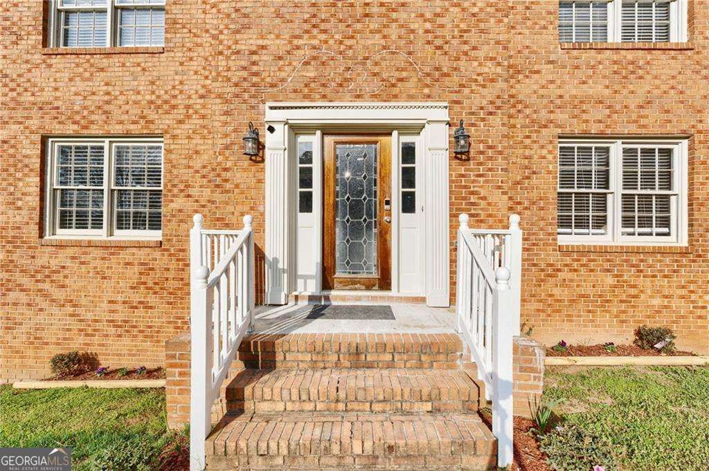 Photo of 835 Lockriver Way, Lawrenceville, GA 30044 (MLS # 10727359)