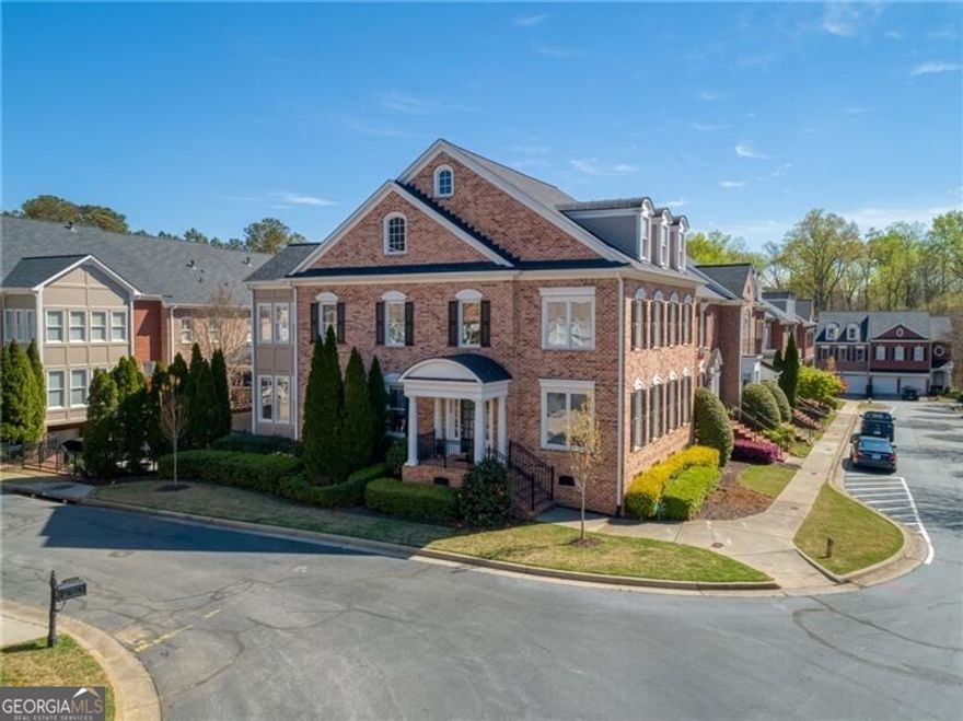 Coveted Gated community walkable to Avalon & Downtown! Desirable  END UNIT with refreshingly different floor plan. Open concept with tons of natural light bring so many options to fit your lifestyle!  Updated Kitchen with barely used Stainless appliance package, coffee bar, Quartz Island and Bar, Breakfast Room and Butler's Pantry. Living Room  and separate coffered-ceiling Dining Room. Den has Fireplace  and 2 glass-paned hidden pocket doors to fabulous Sunroom!  Terrific guest flow between rooms perfect for entertaining family & friends. Ascend curved staircase to spacious Owner's Suite with 10' x 16' Sitting Room or Home Office.  4 yr-old renovated Owner's Spa-feel Bathroom with separate Soaking Tub & Shower, 2 Quartz vanities and 2 walk-in Closets! Perfect!  2 additional bedrooms & Jack & Jill bathroom upstairs. The Terrace Level boasts a Bedroom apartment Suite OR also ideal for a Media/Billiard Room or dedicated business office.  On other side of stairs is flex space and "mudroom" and expanded walk-in closet. Wait till you see the oversized garage!  Wow.  This 2-car+ garage fits a truck or SUV and tons of storage space.  50 steps to Exceptional amenities including Jr-Olympic pool, tennis/pickleball, Clubhouse with popular "live" music Social events and clubs including bookclub, mah jongg, yoga; a well-appointed Fitness Center and tranquil 7-acre walking trail Nature Preserve with 2 private gates that open directly onto Alpha Loop. Find community & walkability at the beautiful & exceptionally maintained Academy Park!