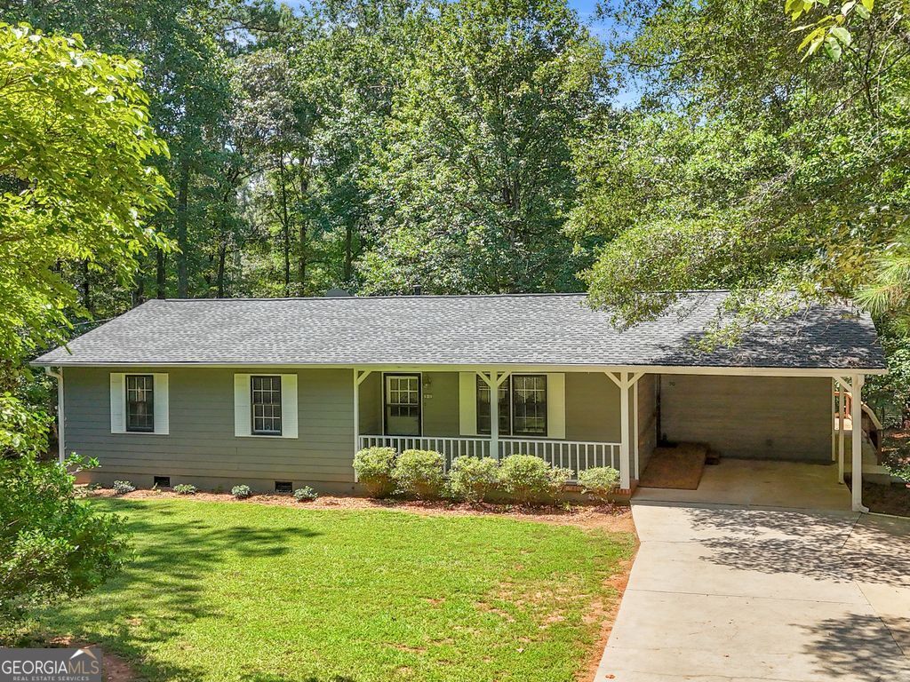 Welcome to this charming 3-bedroom, 2-bath stepless ranch situated on nearly an acre (0.96) of land. The seller purchased the adjacent lot, which, when combined, could be separated after purchase, offering the perfect blend of comfort and convenience. The roof was replaced within the last year, ensuring peace of mind for years to come. Inside, the spacious kitchen features solid surface countertops, stainless steel appliances, and plenty of cabinet space. Enjoy multiple living areas with a bright sunroom and a relaxing screened porch that overlooks the private backyard-perfect for entertaining or unwinding.The primary bedroom includes its own private bath, while two additional bedrooms provide space for family, guests, or a home office. Outdoors, you'll find an expansive yard, a useful outbuilding for storage or hobbies, and plenty of room to enjoy the outdoors. Located just minutes from shopping, dining, entertainment, and quick access to the interstate, this home combines easy living with an unbeatable location.
