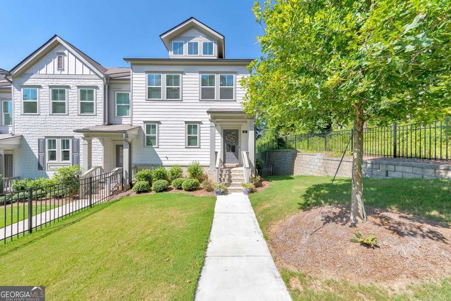 Don't miss this gorgeous end-unit townhome in the heart of Woodstock! Investor-friendly with no rental restrictions! Built in 2022, this 3 bedroom, 3.5 bathroom home offers upgraded finishes including crown molding, recessed lighting, and the privacy that comes with being an end unit. This is the only end-unit currently for sale in the community and features one of the largest yards-perfect for outdoor enjoyment and entertaining. The open-concept main floor showcases a modern kitchen with white cabinets, stone countertops, stainless steel appliances, a pantry, and an island perfect for casual dining. The fireside family room opens to a rear deck, creating the ideal spot for entertaining or relaxing. Upstairs, the primary suite features a walk-in closet and luxurious ensuite with double vanities and a glass-enclosed shower. Two additional bedrooms, a full bath, and upper-level laundry complete the space. Downstairs, the terrace level includes a full bathroom and a versatile bonus room-ideal as a fourth bedroom, office, or media space. Additional highlights include a whole-home dehumidifier for the HVAC system, a fenced front yard, and a 2-car garage. All just minutes from Downtown Woodstock and Noonday Creek Trail.