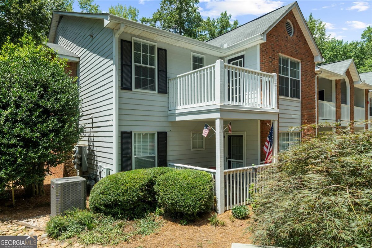 Welcome to 123 Streamside Drive! This beautiful updated top floor end unit condo is move in ready! Private covered front porch welcomes you home into this unit. Large open family room with lots of natural light, and a beautiful stack stone fireplace. This open concept flows to the dining area to the left and to the right of the family room is an additional space perfect for a home office, or additional siting area. The kitchen has been updated with granite counters, and a new backsplash. New lightings fixtures thru the home. This split bedroom plan offers 2 large bedrooms with walk in closets, and private bathrooms. Both bathrooms have new tiled showers, and the primary bath has a beautiful new double sink vanity. Large laundry room with additional storage closet. There is also a private corner deck with this unit for additional outdoor space. This small, gated community offers a community pool just steps from the front door. Easy access to Hembree Park, Avalon, downtown Alpharetta Wellstar Hospital, shopping, dining, and so much more!