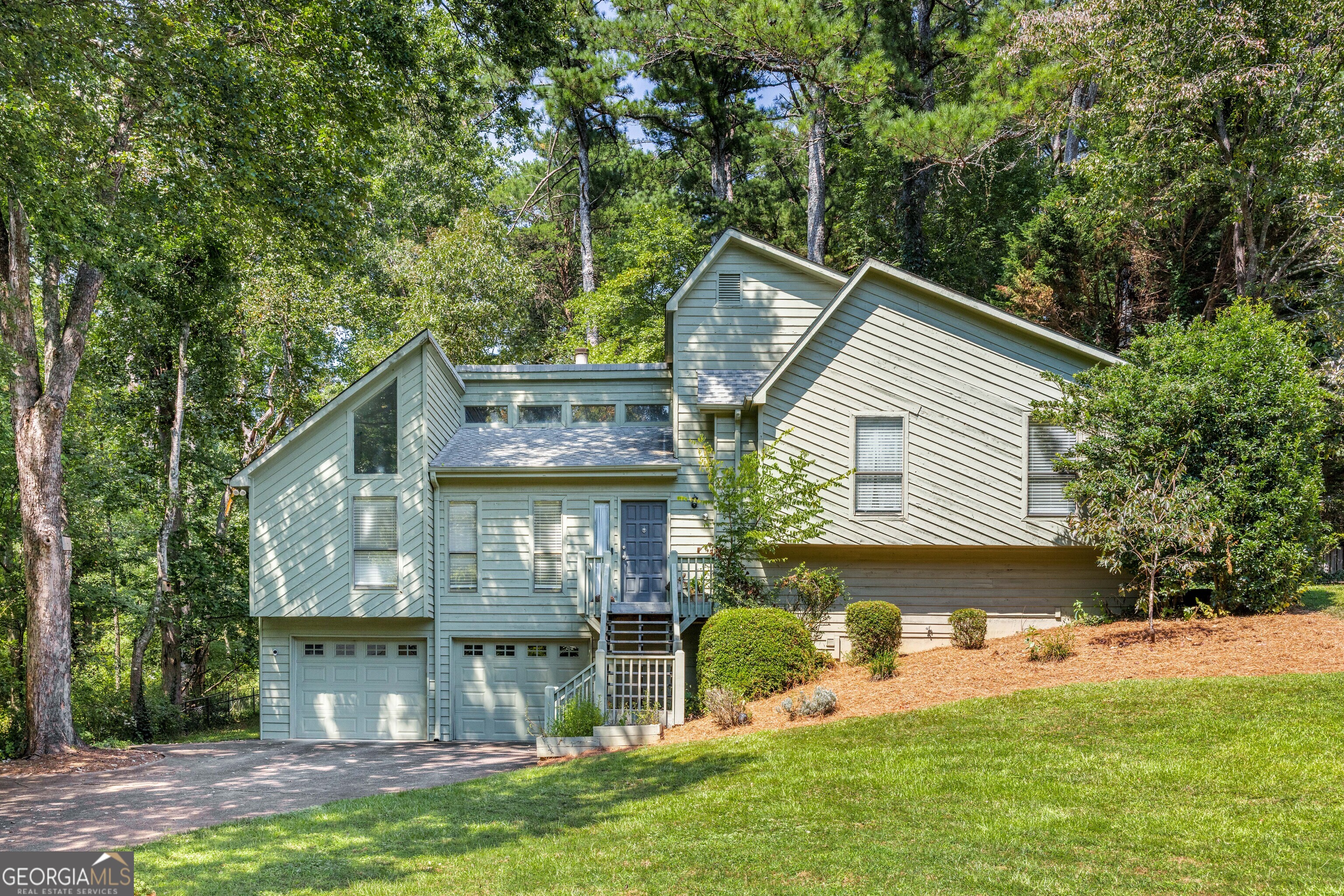 Discover your dream home at 1877 Falcon Wood Drive NE, Marietta, GA. This charming 4-bedroom, 2.5-bathroom residence offers the perfect blend of comfort and style, sprawled across 2,400 square feet of living space. Situated on a generous 14,784 square foot lot, this property promises ample room for both indoor and outdoor living. Step inside to find an open and inviting living area with beautiful hardwood floors that seamlessly transition to cozy carpet in the bedrooms, ideal for relaxation and entertaining. The home features a modern kitchen and a convenient laundry room that adds to the practicality of daily living. The basement offers a versatile playroom space, perfect for hobbies or a recreational area. Outdoor enthusiasts will love the private backyard oasis, complete with a deck for barbecues and gatherings. The community amenities include a playground and tennis court, providing endless opportunities for recreation and leisure. This home invites you to create lasting memories in a modern setting while enjoying all the comforts you desire. Don't miss the opportunity to make it yours!