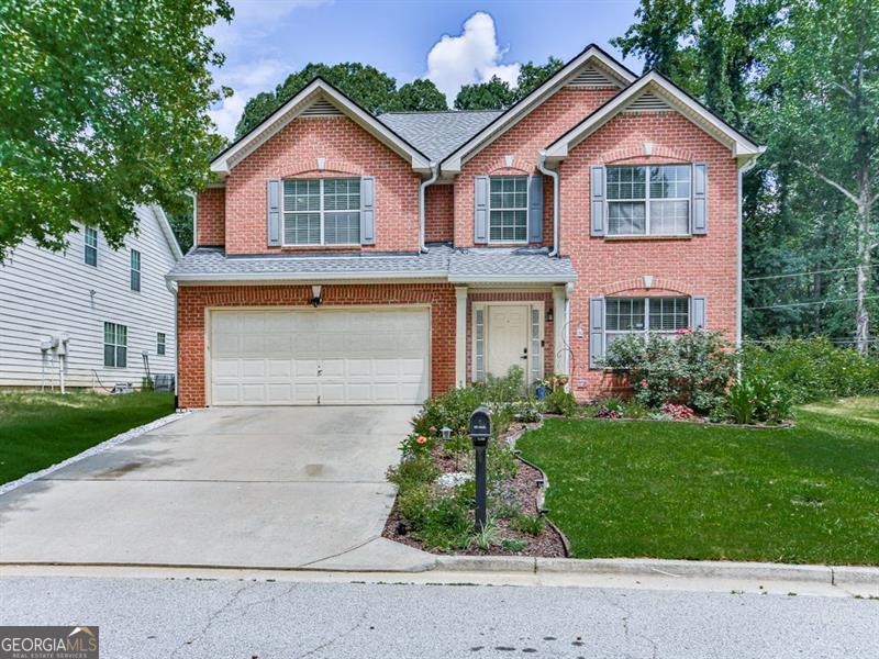 Don't miss your opportunity to own this well maintained home that is conveniently located near dining, shopping, and Atlanta Hartsfield-Jackson airport. This home with an inviting street view features luxury vinyl flooring throughout the main level, a double-sided fireplace and spacious kitchen with solid surface countertops and stainless steel appliances. Upstairs you will find a spacious master suite that features his and hers walk-in closets, tray ceiling and a very large master bath. The bath has separate soaking tub and shower, his and hers vanities and luxury vinyl flooring.