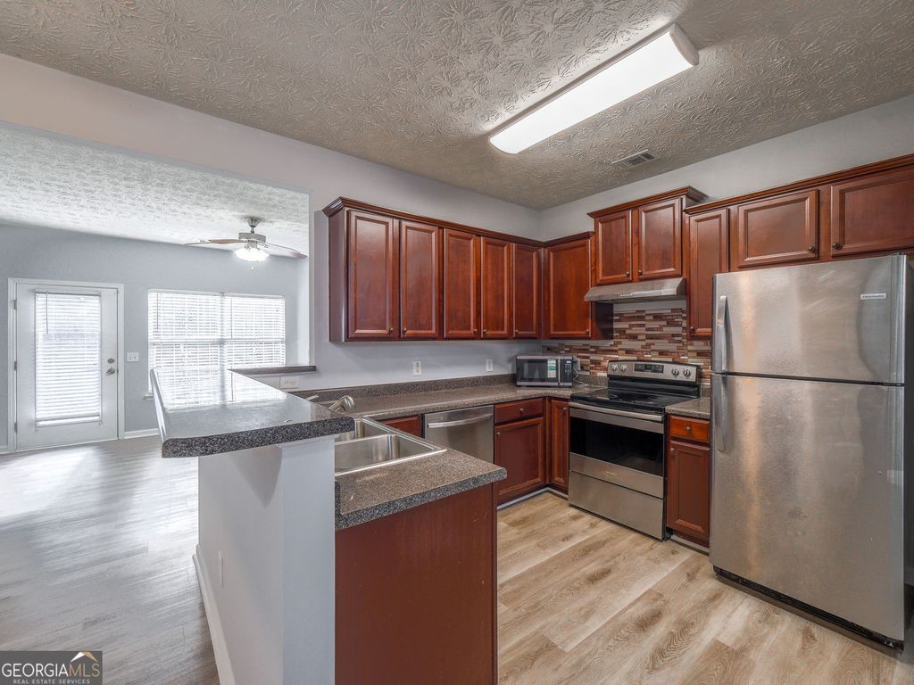 Photo of 2334 Bigwood Trail, Atlanta, GA 30349 (MLS # 10678024)