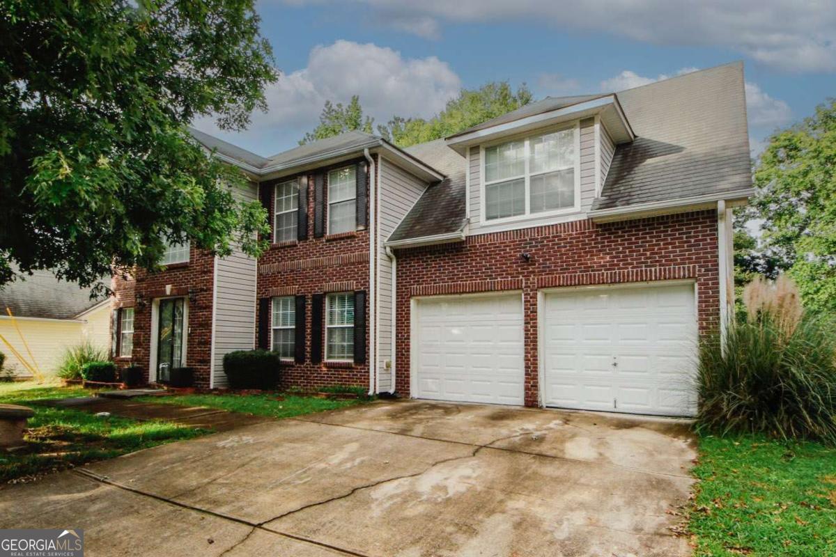 Welcome to this beautiful and well-maintained home in Lithonia! This spacious 4-bedroom, 2.5-bathroom residence offers a comfortable and inviting atmosphere. With about 2,133 square feet of living space, there's plenty of room for everyone to enjoy. The primary bedroom features a private ensuite bathroom, providing added convenience and privacy. The home is move-in ready, with a clean and well cared-for interior that feels just like home from the moment you walk in. The home has a separate living room, a cozy family den/room, and a separate dining area - great for gatherings and everyday living. The eat-in kitchen makes mealtime a breeze! Enjoy the practicality of a double car garage and a fantastic location close to Stone Mountain Park, Highway 78, and shopping options including Publix. Whether you're relaxing at home or exploring the nearby attractions and amenities, this property is a wonderful place to start your next chapter. Don't miss out on this fantastic opportunity!