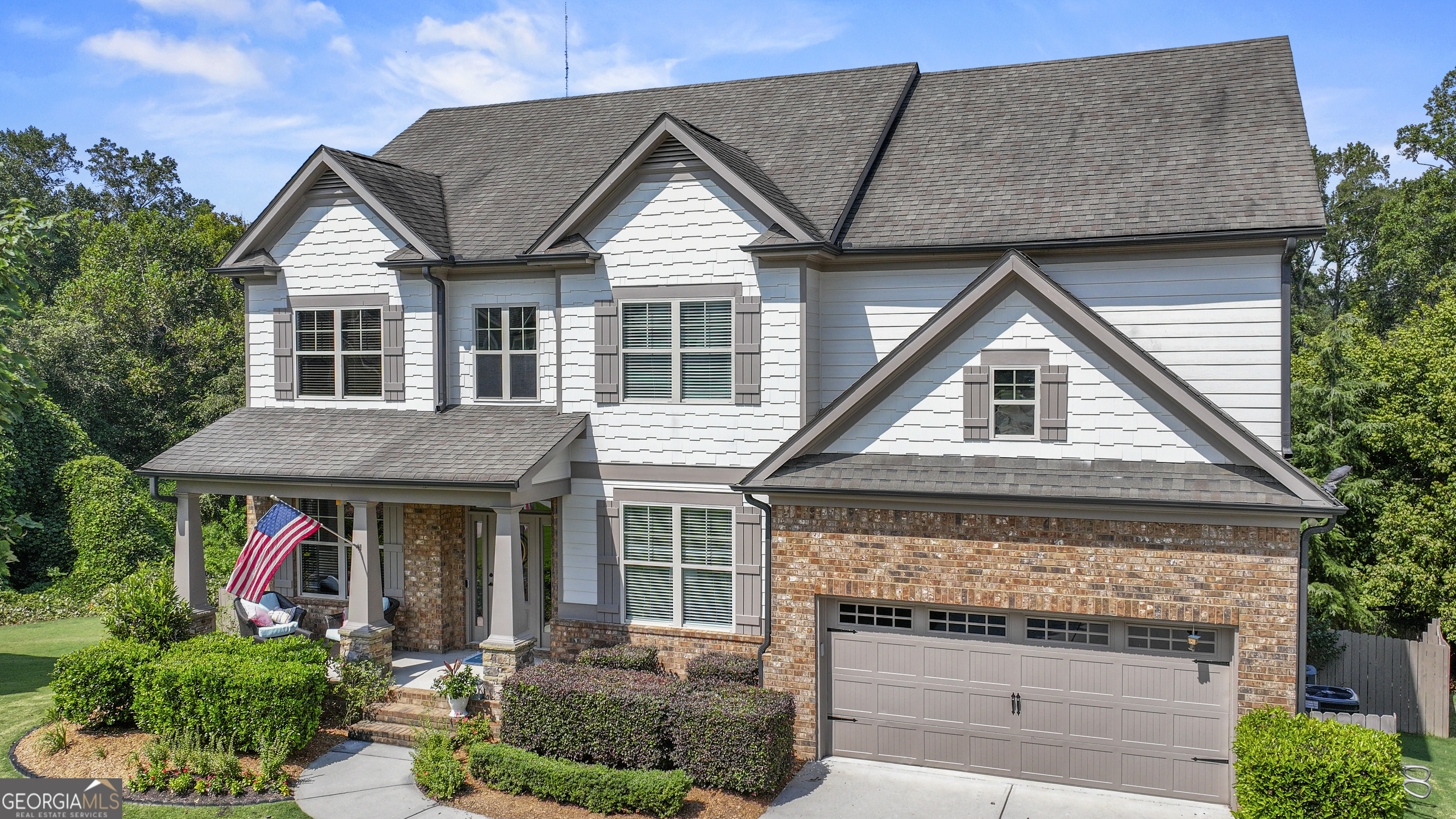 Welcome to your dream home in the highly sought-after Riverstone Park Subdivision! This beautifully maintained 5-bedroom, 4-bathroom home offers nearly 4,700 sq ft of living space, nestled in a quiet cul-de-sac and backing up to the peaceful Mulberry River. Enjoy the perfect blend of luxury and functionality with a full finished basement - ideal for entertaining guests or cozy family nights in featuring a recreation room and a dedicated theater room, exercise room, workshop, and unfinished storage area. The main level includes a private office, a separate dining room, and access to a covered back deck overlooking a fenced-in backyard. This back deck offers a serene setting for morning coffee or evening relaxation, large open kitchen that overlooks the backyard and into the open main living area. Upstairs, you'll find four spacious bedrooms, including an oversized master suite with ample space to unwind. An open family room provides additional living space perfect for a play area, reading nook, or secondary lounge. Riverstone Park is an active, family-friendly community with amenities for everyone including a large swimming pool, two playgrounds, tennis courts, and pickleball courts, along with neighborhood events planned throughout the year for both kids and adults. This is more than just a home, it's a lifestyle. Don't miss your chance to own this one-of-a-kind property in one of Braselton's most vibrant neighborhoods!