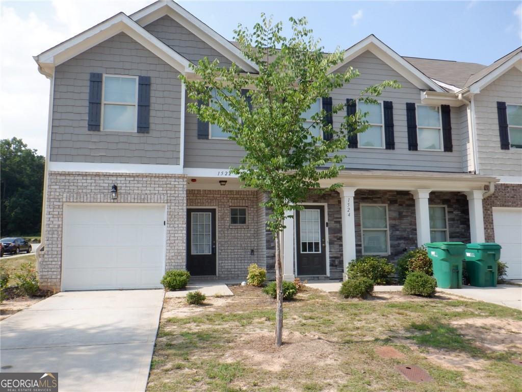 You'll love this practically new & open floor plan, end unit townhome! Move in ready with fresh paint & new carpet. Hardwood on the main level. Gleaming, beautiful kitchen with granite countertops. Cozy family room with dining area. Upper level features a spacious master suite with a vaulted ceiling, walk in closet, granite countertop & tub/shower combo. 2 secondary bedrooms, guest bathroom & laundry room also on the upper level. Side yard/backyard great for entertaining. Easy access to Atlanta airport, restaurants, and shopping. No pets, 600+ credit score & a 24 month lease term is preferred. 12 month lease rate is $1850. Hurry, this won't last long!