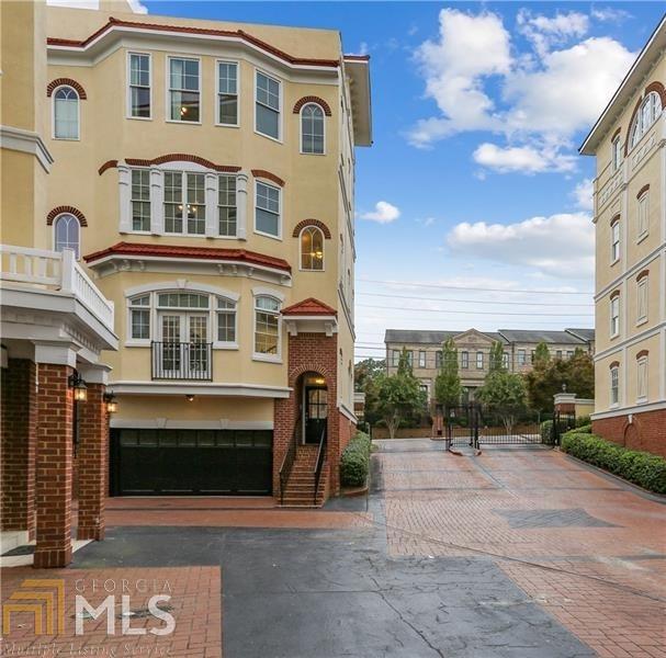 End-unit townhouse in the best Buckhead location! This gated property features rooftop terrace, attached two car garage, and multi-level living with low HOA fees! Private entry leads to light-filled main floor with open-concept kitchen and great room--perfect for entertaining! Upstairs, large owner's suite features wall of windows, walk-in closet, and bathroom with oversized shower, jetted tub, double vanities. Two additional bedrooms share bathroom. Rooftop patio with ample space provides endless opportunities! Plantation shutters and hardwood floors throughout! Designated visitor parking! AMAZING VALUE!!