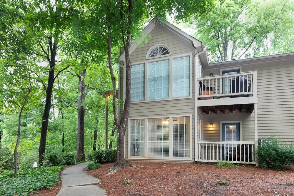 Enjoy this Immaculate, Newly Renovated, Main Level, End Unit Condo Located in the Pristine Part of Smyrna. Open Floor Plan has a Spacious Living Room with a Stack Stone Fireplace to Enjoy. New HVAC. Adjacent Sunroom is Perfect for an Office or Creating a Plant Oasis. Lots of Natural Light from the Floor to Ceiling Windows with Views of the Private Patio. Adorable Dining Room Opens to the Exquisite Kitchen with Lots of Stained Custom Cabinets, Designer Knobs, Granite Counters & ALL Stainless Steel Appliances Stays. Master Bedroom for A King Bed and has its Own Patio Entrance. Updated Bathroom w/Double Vanity, Stained Cabinets and Granite Counters. Beautiful Built in Tiled Garden Tub/Shower. Roomy Secondary Bedroom. Plenty of storage in the Laundry Closet. Freshly Painted Throughout. Neighborhood amenities include a pool and 2 tennis courts. Conveniently located on Smyrna's Spring Road corridor less than 2 miles to Truist Park Baseball Stadium, Battery Shops, Restaurants and Smyrna Market Village. Easy access to all major highways including Cobb Parkway/41, 75 and 285, Cobb Galleria Office Park and Cumberland Mall!