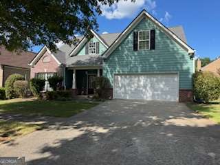This beautiful 4 bedroom, 2.5 bath home offers one of the largest floor plans in the subdivision! The main floor includes a formal living room, a separate dining room, a well-equipped kitchen, and a cozy family room with a fireplace-ideal for entertaining guests or relaxing with family. Upstairs, enjoy a huge Master Suite featuring a generous sitting area, perfect for a home office or private retreat. Located just minutes from I-85, the Mall of Georgia, and a wide variety of shops and restaurants. Situated in a highly rated school district, this home combines space, comfort, and convenience in one unbeatable package. WE NEVER ADVERTISE ON CRAIGSLIST