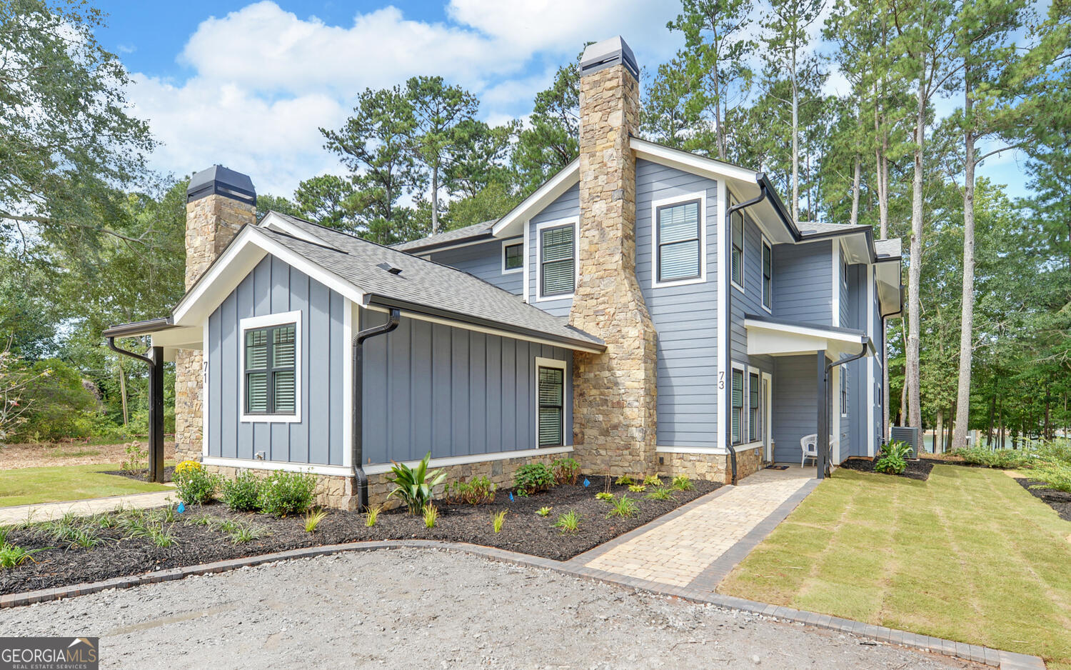 Lake Hartwell New Construction Townhome - Short-Term Rental Friendly! Welcome to an exclusive opportunity on the shores of Lake Hartwell! This stunning new construction duplex townhome is located within the city limits, offering the convenience of city water, sewer, and natural gas-a rare find for lake living. Whether you're seeking the perfect lake getaway for your family and friends or looking for a profitable Airbnb or VRBO investment, this property checks all the boxes. Featuring 3 spacious bedrooms and 3.5 designer baths, every inch of this home is crafted with quality and comfort in mind. Enjoy Hardiplank siding, dry stack cobblestone accents, a natural gas fireplace, and a stylish interior with LVP flooring, custom light fixtures, custom white oak cabinets, and quartz countertops throughout. The upstairs includes a cozy coffee bar and opens to a covered upper deck with peaceful views of Lake Hartwell. Best of all, this townhome comes with your own private dock slip on a shared double slip dock, making lake access effortless. Association maintains the grounds and upkeep year round. Completion date 7/30/2025
