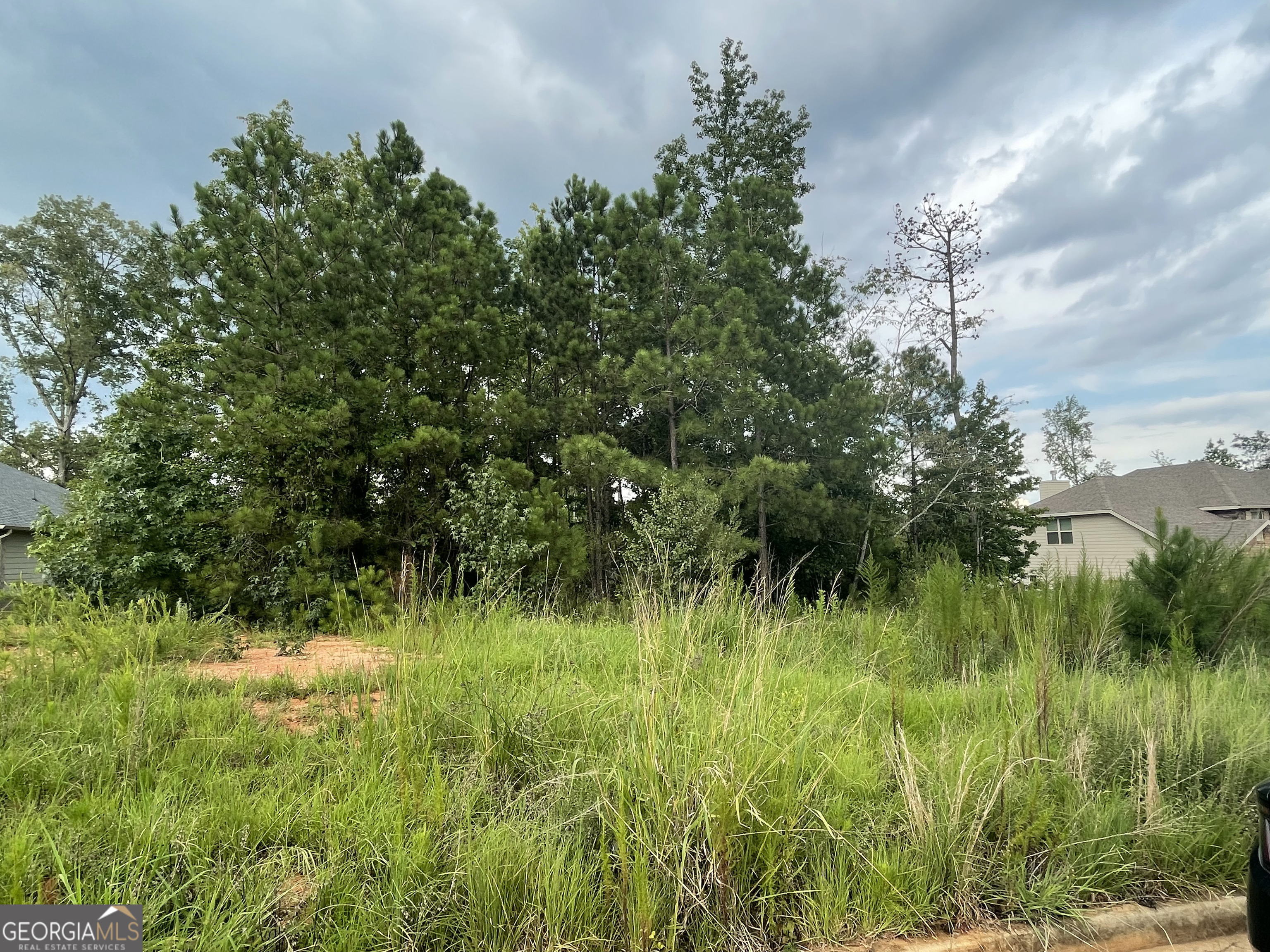 Discover the perfect location for your new home with this spacious buildable lot, ideally situated between Newnan and downtown Griffin. This prime parcel offers the convenience of public water and public sewer, ensuring a hassle-free building process. Nestled in a thriving subdivision known for its beautiful new homes, this lot is a fantastic opportunity to join a growing and vibrant community. Golf enthusiasts will appreciate the proximity to The Club at Shoals Creek, just a short drive away. Enjoy the best of both worlds with easy access to recreational activities and local shops. Don't miss your chance to invest in this exceptional lot and create the home of your dreams in a desirable location.