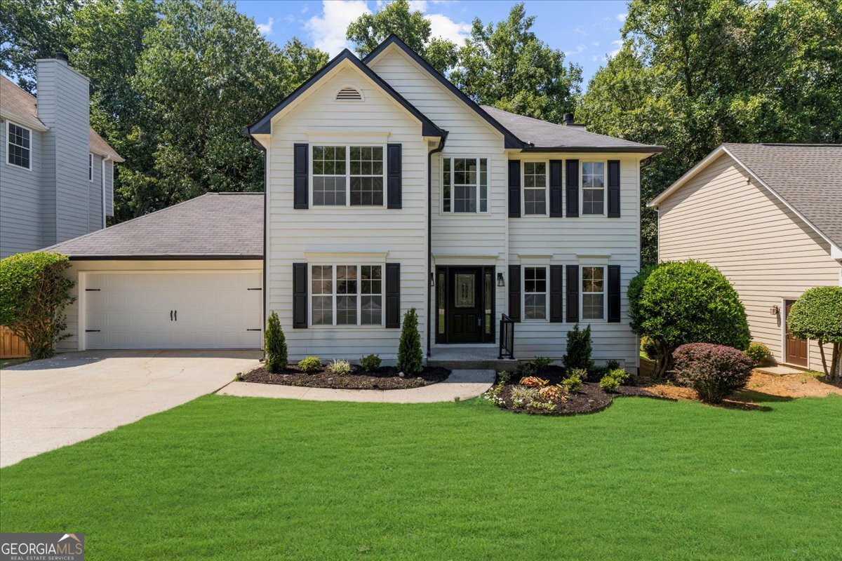 BEAUTIFUL MOVE-IN READY HOME! Enjoy living in this stunningly renovated 5-bedroom, 3-bathroom home in Suwanee, Georgia. Featuring not one, but two primary bedrooms, plus a full finished basement with a bedroom, large recreation room, and full bathroom- perfect for a potential in-law suite! Plenty of storage throughout. This spacious and versatile home has been freshly painted inside and out. The roof was recently replaced, and the water heater is brand new, offering peace of mind for years to come. You'll love the hardwood floors on the main level, brand-new carpet, and updated bathrooms. The kitchen is a true showpiece, featuring stone countertops, a new backsplash, stainless steel appliances, and ample cabinet space. The open-concept layout seamlessly connects living areas, making it ideal for entertaining or relaxing in comfort. Conveniently located just minutes from restaurants, coffee shops, and family-friendly amenities, this home offers the perfect blend of comfort and lifestyle. Don't miss out-schedule your showing today!