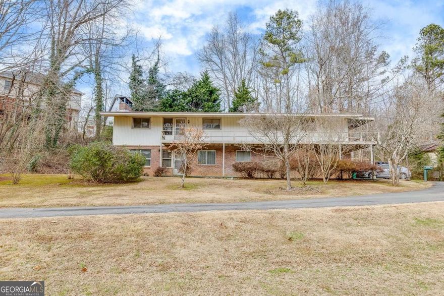 10 Acres! 10 Acres! LAND! LAND! Home features 4 bedrooms and 3 bathrooms nestled on a rare 10 ACRES parcel of land in Kennesaw GA! NO HOA and offers a rare combination of privacy, convenience, and opportunity. The possibilities are endless. Property is minutes from Kennesaw State University and I-75. Whether you are seeking for outdoor exploration, room to expand or a versatile property to fit your vision, this acreage is a perfect match