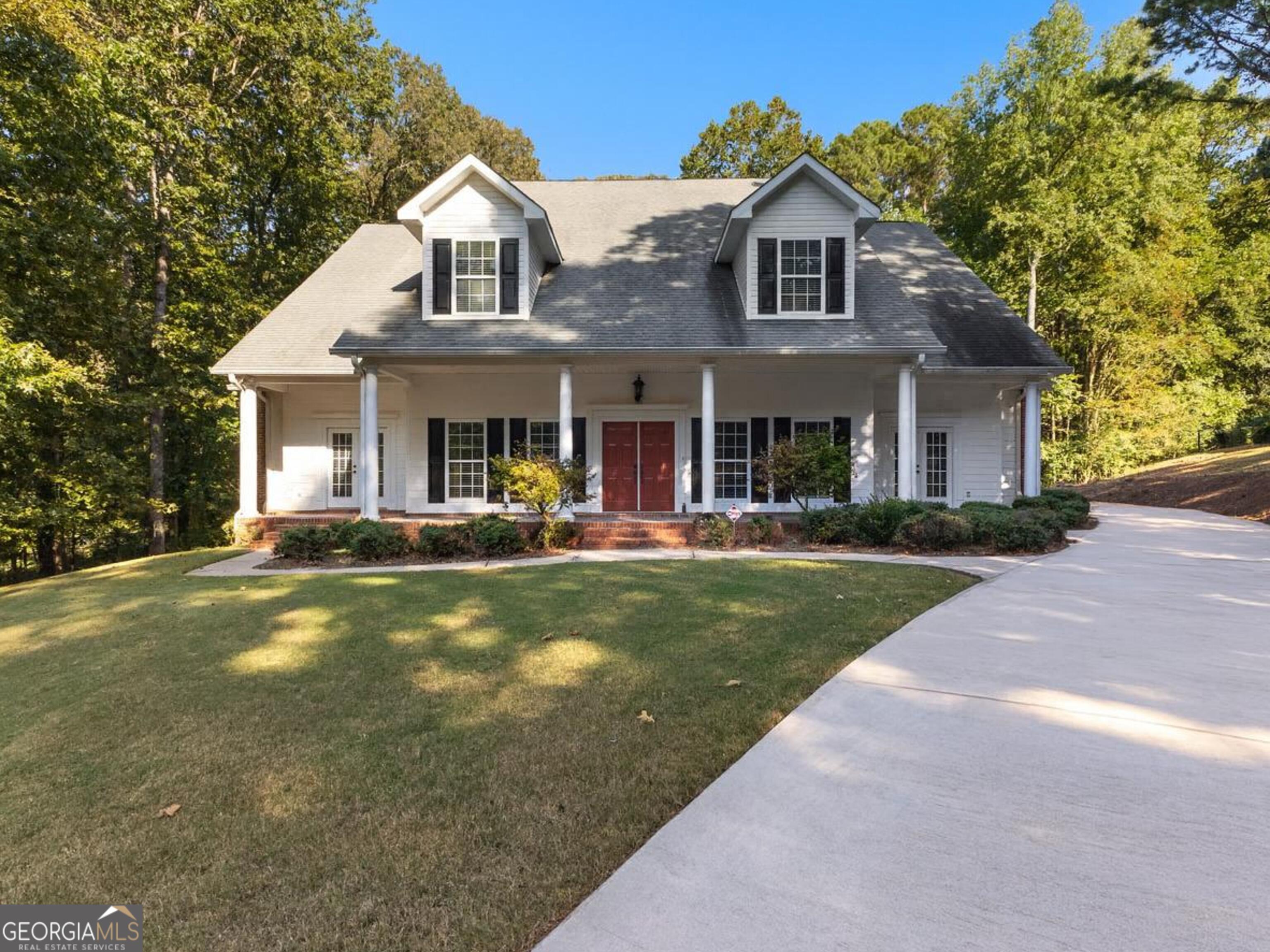 You don't want to miss this spacious 4-5 bedroom, 3.5 bath home in the highly sought-after Cameron Pointe Subdivision-just 2 minutes from beautiful West Point Lake. This custom-designed property offers nearly 4,000 sq ft of living space along with an oversized 4-car garage. Featuring an open floor plan with soaring 10-foot ceilings, hardwood floors, and two classic brick fireplaces with gas logs, the home balances elegance with everyday comfort. Two primary suites on the main level make it ideal for multi-generational living or hosting guests. The large kitchen, complete with a center island and abundant cabinetry, is perfect for gatherings. French doors at the front provide a charming spot to enjoy morning coffee, while the spacious laundry/mud room and half bath add convenience. At the back of the home, a den/sunroom opens onto a 23' x 26' screened-in porch and patio-creating an inviting retreat for relaxation or entertaining. Upstairs you'll find two additional bedrooms, a full bath, and an optional fifth bedroom, all with generous storage. Cameron Pointe residents enjoy resort-style amenities including a pool, clubhouse, and tennis courts. With its expansive interiors, thoughtful design, and desirable neighborhood features, this home is perfectly suited for both everyday living and memorable entertaining.