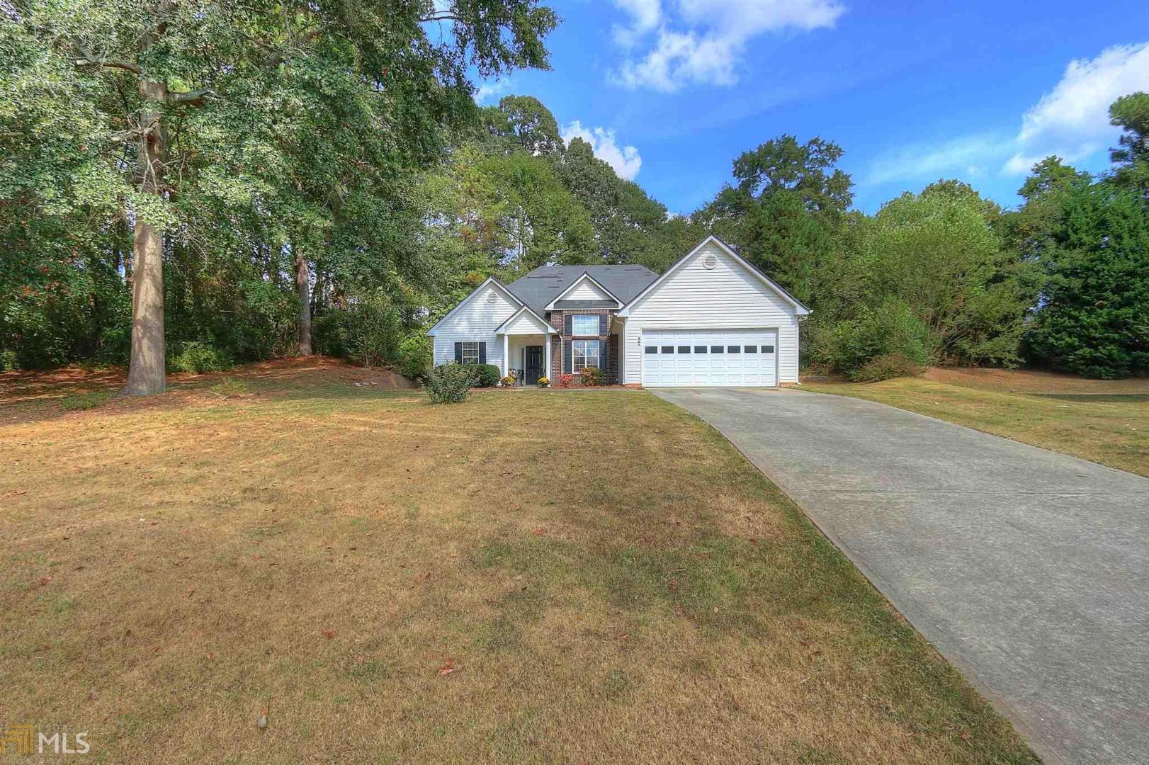 Gorgeous open flowing ranch home, offering the Savannah plan. Split bedroom plan with a large master bedroom with trey ceiling. Large master bath with garden tub and a separate shower. Walk in master closet with lots of space. Kitchen offers plenty of cabinet space for storage along with great counter top space as well. Nice cozy front room with fireplace offers the perfect setting to entertain friends. Separate dining room offers a great space for large dinners. Very private fenced in back yard with a cozy patio. Back part of the yard offers a great place for gardening. There is a neighborhood lake right around the corner from this home. Quiet neighborhood with convenience to Monroe, Loganville, Covington, Social Circle and Conyers. No HOA!!