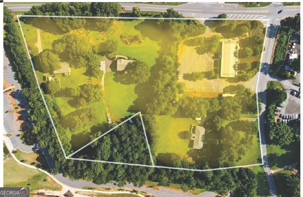 UPDATE: Assemblage of 4 possibly 5 lots bringing acreage to 10.58. Located on the cusp of Acworth and Woodstock (5 minutes from downtown). DEVELOPERS NEEDED!!! Need a Developer for this prime location within the Bell's Ferry Overlaying District. A unique advantage with no-public-hearing and quick Rezoning. Comprised of Residential and Commercial zoning RD3 and GC. Sewer line access. This opportunity is ideal, great location, most of the land is flat. Beautiful property! With the corner-lot the area will be a staple location! Tenants will absolutely flock here, and they will boast to call it home, in the heart of the Bell's Ferry Overlaying District. Mixed-use would be perfect. County suggest keeping 1% commercial. Shopping centers within .5-mile radius and Lake Allatoona is 1.5 mile. "MORE ROOFS WANTED" in this area. Heads up the price is premium. We need Developers to make an impact and its surrounding communities. Zoning is 12 units per acre and 8 units per acre, total unit potential is 80 units. A lot of progress, already taking place in Acworth/Woodstock!