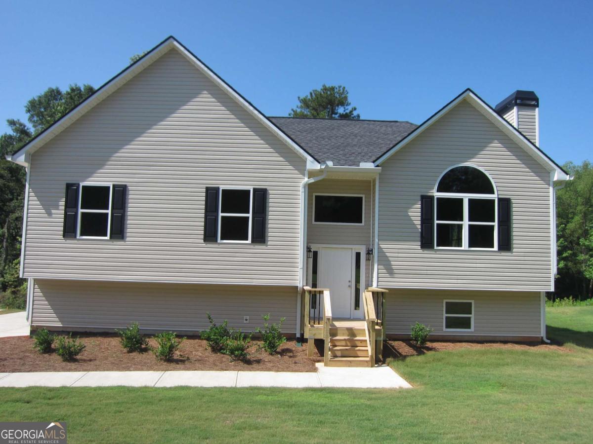 *** 100% FINANCING AVAILABLE ON THIS HOME*** New Construction Split Foyer available for immediate occupancy. This split foyer boasts over 2,000 SF of finished area. A huge double drive under garage leads you into a full finished BONUS ROOM with a full bathroom. Upstairs you'll find 3 bedrooms and 2 full bathrooms, all with 9 foot ceilings. Along with the vaulted great room with a fireplace, there is a dining room set up for your 12 seat dining table and hutch. The kitchen features vaulted ceilings, solid countertops, all stainless appliances, soft close-stained cabinets and a pantry for your storage needs. The master bedroom features a trey ceiling with a ceiling fan and the master bath includes solid counter tops and both a garden tub and a separate shower unit. All these features are available along with a huge rear deck and a sodded front and side yards. No HOA fees to worry about. The home is APPROVED FOR A USDA HOME LOAN, and we have 100% FINANCING WITH NO PRIVATE MORTAGE INSURANCE(PMI) REQUIRED!!! PROVIDED BY UNITED COMMUNITY MORTGAGE. Make plans to come and see this beautiful home for yourself!