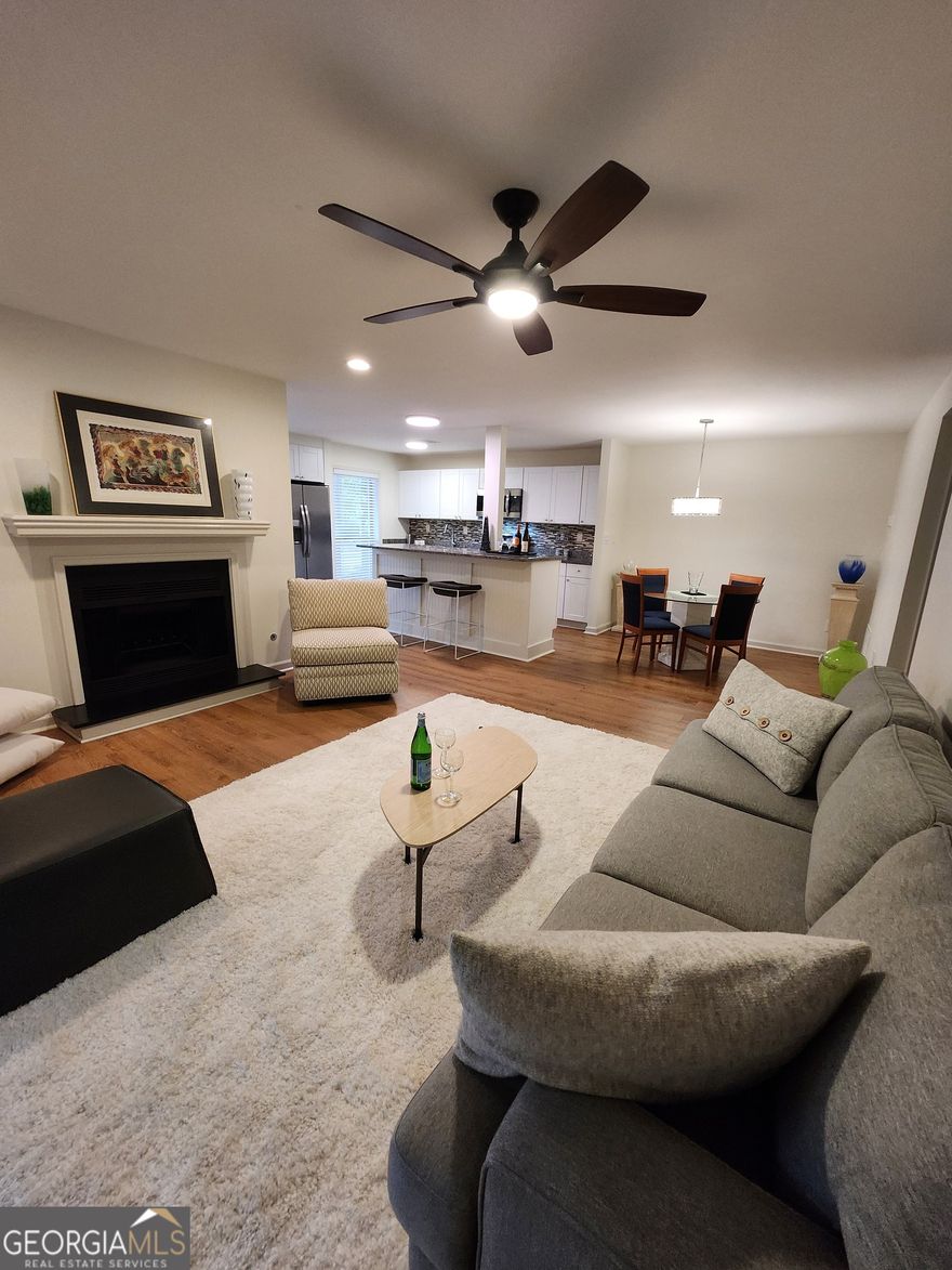 Don't miss this beautifully updated condo featuring an open concept plan with the kitchen totally open to the living and dining spaces! The kitchen features granite countertops, mosaic backsplash, and stainless-steel appliances! The newly updated bath features a new vanity with granite countertop, double bowl stainless-steel sink with disposal and pullout faucet, porcelain floor and wall tile! The rooms are spacious and have been freshly painted in a neutral palate! Smooth finished ceilings throughout! LVP flooring! Beautiful light fixtures and fans all feature LED lighting and dimmers throughout! Laundry room comes with LG front load washer and dryer with storage pedestals! Don't miss the huge screen porch that has been freshly painted to match the interior color palate and carpeted with carpet tiles and lit with LED Edison style string lights to create a warm glow for entertaining or just relaxing and enjoying the wooded views!