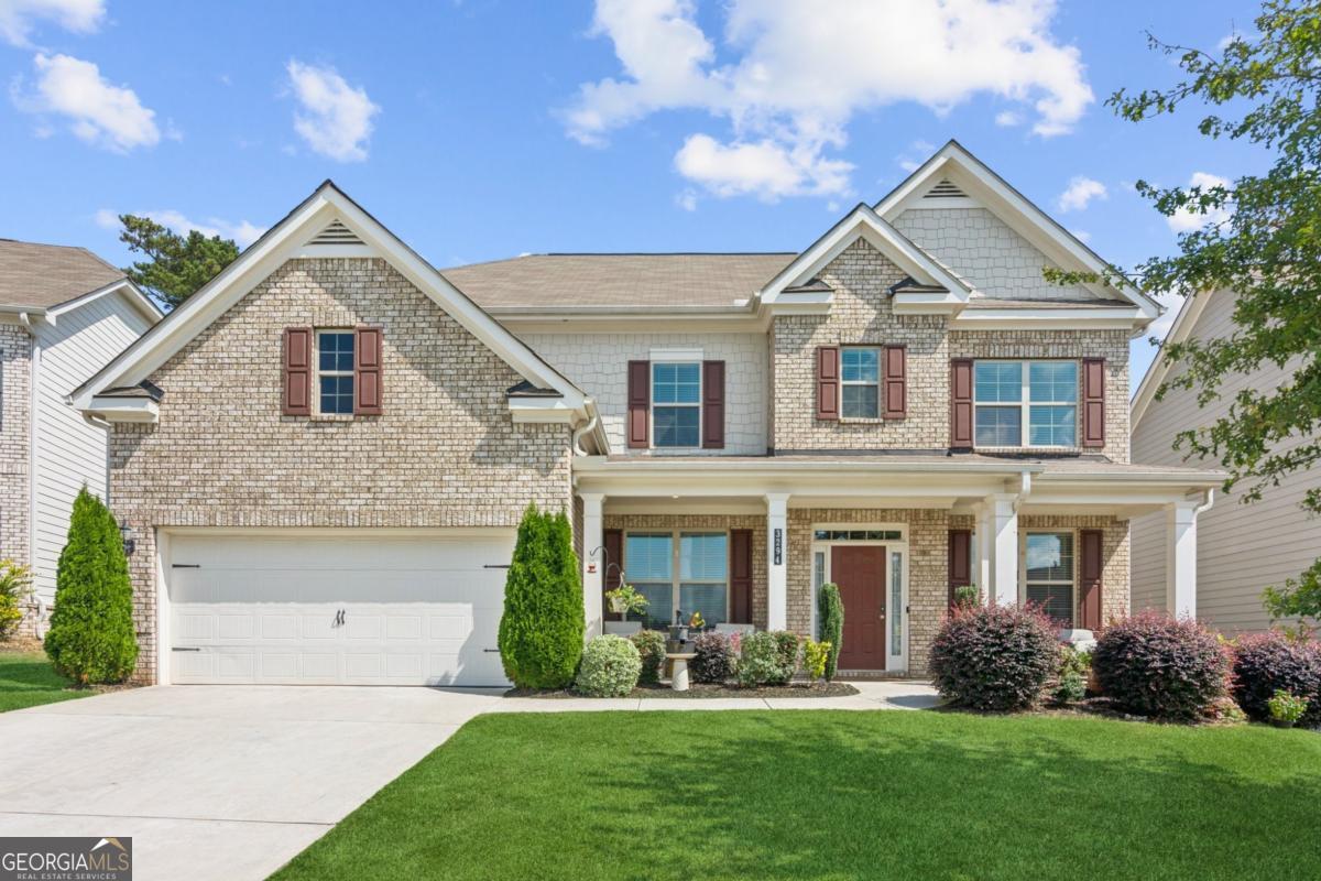 Stunning 5 Bedroom, 4 Bath Home - Move-In Ready! Beautifully maintained and designed for today's lifestyle, this spacious home offers an open concept kitchen and family room perfect for entertaining. The kitchen features stone countertops, a double oven, and a gas cooktop, while the family room boasts a cozy fireplace with gas logs. The oversized master suite includes an ensuite bathroom, a walk-in closet, and a charming electric fireplace insert. Upstairs you'll also find a versatile bonus room, ideal for a playroom, office, or media space. A main-level guest bedroom with full bath provides convenience, along with a complete laundry room featuring a sink. Step outside to a private, fully fenced backyard with a covered patio and ceiling fans, creating the perfect setting for year-round enjoyment. Located close to shopping, dining, and activities, this home combines comfort and convenience in one exceptional package.