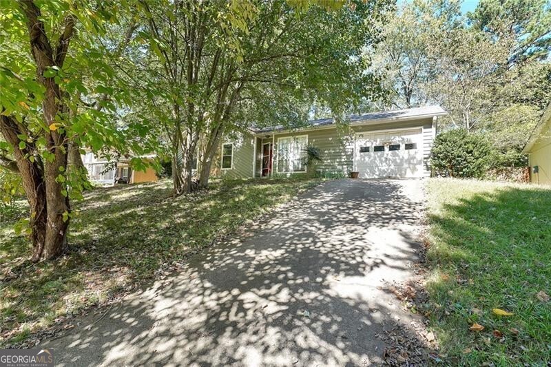 This nearly move-in ready split-level home in The Woods subdivision is conveniently located walking distance to the Indian Creek Marta Station. The living spaces include an inviting living room with a cozy stone fireplace, separate but open dining room that can seat your favorite people, and a spacious eat-in kitchen with lots of cabinet and counter space to store and chop everything you need to create yummy memories! Off the dining room is access to a nice, large backyard for grill'n and chill'n on the large patio and plenty of level grass for your two legged and four legged friends to play. Down the hall, there are 2 secondary bedrooms, a full bathroom and the primary suite with its own private full bathroom. A laundry closet, fenced yard and enclosed garage complete the footprint of this home. The sale of this Property is contingent upon an Order from the DeKalb, Fulton, Clayton, and/or Gwinnett County Probate Court granting a Petition for Leave to Sell it. Expect 1 - 3 months after an accepted offer for the property to close, depending on holidays and inventory in the judge's pipeline.