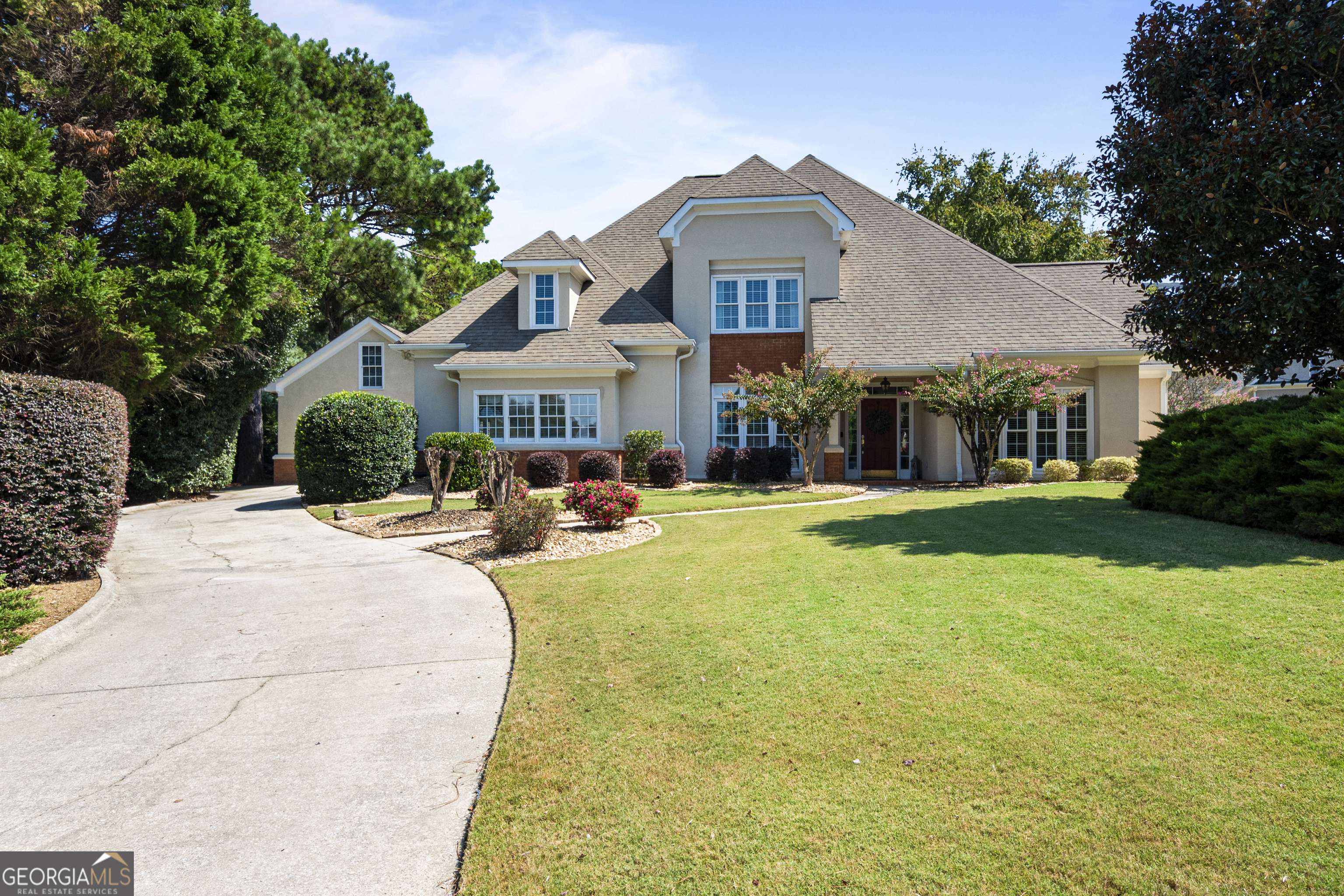 Starr's Mill gem, on a cul du sac, in Peachtree City's sought after Muirfield Subdivision. Updated and ready for new owners, this big 5BR/3.5 home with detached garage, stubbed for a bath is the perfect family home. On the Braelinn golf course, this floor plan is everything you could hope for, with the primary bedroom on the main level. Beautifully updated kitchen, dining room, office, and a large Media room round out the 1st floor. The 2nd floor boasts 4 more nicely sized bedrooms and two more updated bathrooms. Step into the beautifully landscaped, fully fenced back yard and enjoy being on the golf course with a hedge of privacy. Ideally located a quick golf cart ride from workout facilities, pool and tennis facilities at the country club The 2 large outdoor living spaces are perfect for entertaining friends and family. Dont miss this beaury...the interest rates are dropping!