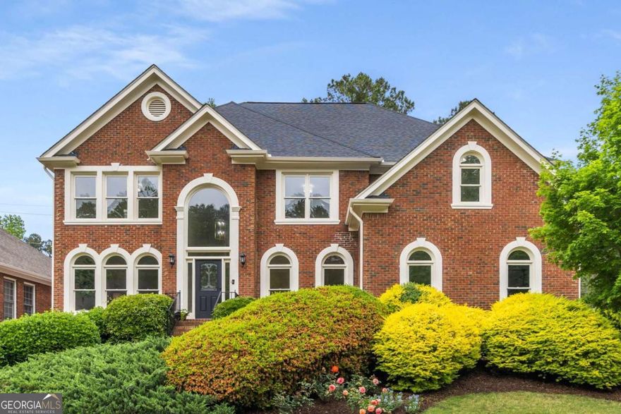 Welcome to a distinguished sanctuary of elegance and sophistication at 200 Welford Trace, ideally situated in the heart of Alpharetta. Located within the highly sought-after Crabapple Crossing Elementary and Milton High School districts, this exquisitely renovated residence showcases incredible attention to detail across three expansive levels, offering 5,274 square feet of luxurious living space on a generously sized lot. Boasting six beautifully designed bedrooms and five luxurious bathrooms, every inch of this home has been thoughtfully reimagined-nothing has been left untouched. All-new appliances, pristine hardwood floors throughout, and elevated finishes bring a fresh, modern feel to this timeless property. The grandeur begins at the foyer and flows into a formal dining room adorned with custom moulding throughout. At the heart of the home, the chef's kitchen features an open-concept layout with an expansive island, premium countertops, and state-of-the-art stainless steel appliances, including a gas stove and double ovens-ideal for entertaining and everyday living. The primary suite offers a true retreat with a spa-inspired ensuite featuring a wet room with oversized shower and soaking tub, and a massive walk-in closet. Three additional bedrooms are located on this level-one with an en suite bath, while the other two share a Jack and Jill layout. The finished terrace level provides versatile space for a media room, fitness area, wine cellar, or all of the above. Complete with a bedroom, full bath, and a full kitchen, it's perfectly suited for multi-generational living or hosting long-term guests. Outdoors, established gardens and an expansive yard offer a peaceful oasis for both relaxation and entertaining, complete with an oversized deck and barbecue area. This stunning home is a rare opportunity to enjoy modern luxury in a classic Alpharetta setting. Welcome home.