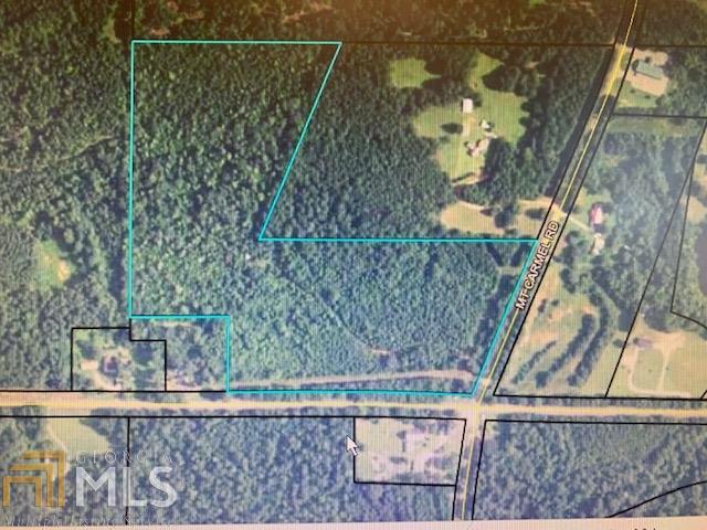 30 plus wooded acres land lot to build your next home or for pure enjoyment for hunting or just that weekend getaway - Convenient to I-85, Newnan, and Lagrange. Land features mature pines several oak and cedar trees, level and sloping topography, 2 road frontages on Mt Camel, and Hwy 362. This property is full of Deer, Turkey and other wild game. Must see this property to appreciate it..