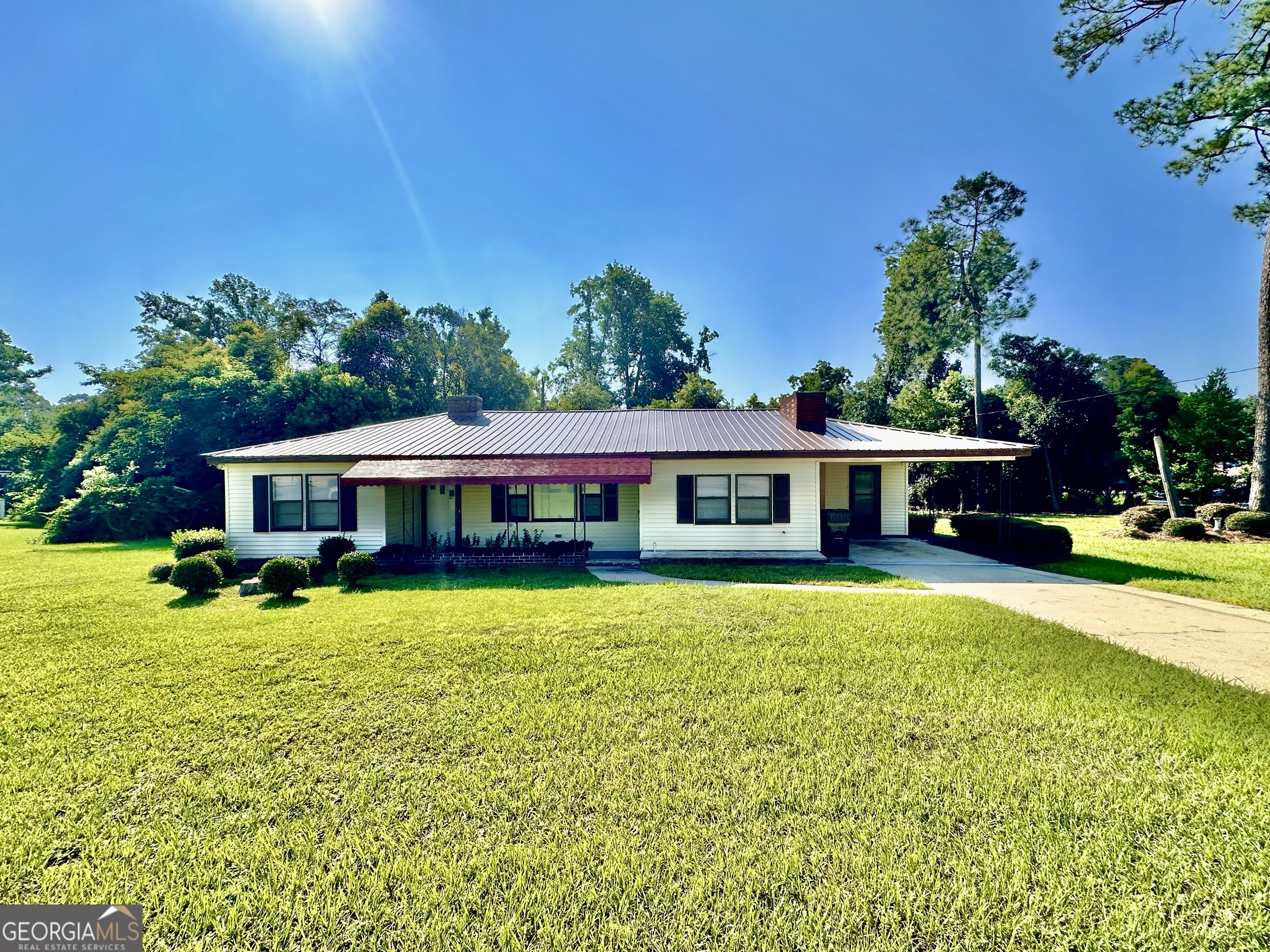 Versatile 3-Bed, 2-Bath Home with Multiple Living Areas | 1504 Habersham Welcome to 1504 Habersham - a charming and flexible 3-bedroom, 2-bath home nestled on a well-kept 0.28-acre lot. This home offers multiple living areas including a spacious living room, cozy den, and a bright sunroom, providing endless layout options for entertaining, relaxing, or working from home. Each of the two front doors opens into its own distinct living space, allowing for creative configurations such as a formal sitting area, family room, or even a private guest suite. There are two fireplaces in the home - one located in each main living space - adding warmth, character, and comfort to both rooms. The sunroom is a standout feature, offering access to both the carport and the backyard through a sliding glass door - perfect for indoor-outdoor living. Inside, you'll find a generous kitchen with abundant cabinet storage, a large pantry, and plenty of room for dining or meal prep. The three bedrooms are nicely sized, and the two bathrooms add convenience for both family and guests. Enjoy mornings on the charming covered front porch, and benefit from the ease of a single-car carport with direct entry into the home. Whether you're a first-time buyer, looking to downsize, or seeking a home with flexible living spaces, this property delivers both comfort and potential. Convenient location, spacious layout, and lots of natural light - don't miss out on this inviting home at 1504 Habersham.