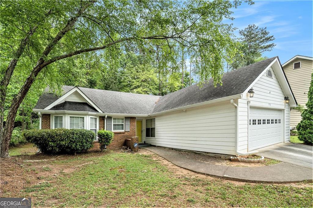 **Stunningly Upgraded 3-Bedroom Home in Quaint Wellborn, Lithonia!** Step into luxury with this beautifully upgraded **3-bedroom, 2-bathroom** gem nestled in the charming Wellborn neighborhood of Lithonia! This **total electric** home exudes elegance, featuring **fresh interior paint**, sleek **LVP flooring**, **new HVAC**, and an Energy Efficient thermostat, alongside **brand-new ceramic tile** in the kitchen and bathrooms. Plush **new carpet** adds warmth, while the **completely renovated white kitchen** boasts **new countertops**, perfect for culinary enthusiasts. The open-concept layout offers a **seamless kitchen-to-dining view**, ideal for entertaining. The sought-after **roommate floor plan** ensures privacy, while the **expansive owner's suite** is a true retreat with **a walk-in closet, soaring ceilings, and a spa-like en suite** featuring a **brand-new single sink vanity, separate tub-shower, and pristine ceramic tile flooring**. Outside, enjoy Georgia's beautiful seasons on your **ground-level wood deck**, perfect for gatherings. A **new garage door and motor** provide modern convenience, while **new light fixtures** and a **dusk-to-dawn floodlight** ADT enhanced security system and ambiance. With an **insulated attic** for energy efficiency, this home is a must-see! Don't miss this stunning **move-in-ready** opportunity-schedule your showing today!