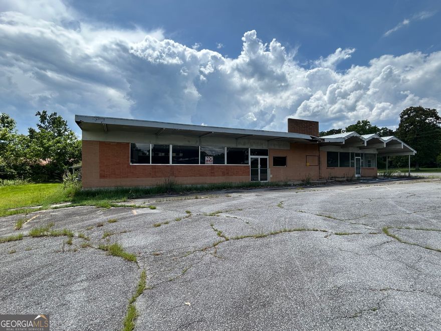 Prime Commercial Property with Endless Possibilities!    Welcome to a remarkable opportunity in the heart of Milan! This expansive commercial property boasts an impressive 4,006 square feet situated on a generous .84 acres, providing ample space for various business ventures. Whether you're looking to expand your existing enterprise or embark on a new venture with endless storage possibilities, this property is perfectly positioned for success.    Key Features:    Spacious Interior: With over 4,000 square feet, the layout is designed to accommodate a diverse range of businesses-from retail stores to offices, and everything in between. The open floor plan allows for flexible configurations to suit your specific needs. This is one building split into two separate spaces. One is 2,240 square feet and the other is 1,766 square feet. Totaling 4,006 square feet.      New Metal Roof: A recent upgrade to a durable metal roof on one side not only enhances the aesthetic appeal but also provides longevity and peace of mind against the elements. This feature significantly reduces maintenance costs and ensures your investment stands the test of time.      Expansive Parking Lot: Say goodbye to parking woes! This property features an enormous parking lot, offering ample space for customers, employees, visitors and more storage. The convenience of on-site parking enhances accessibility, making your business inviting and customer-friendly.    Outdoor Space: The generous lot size offers additional outdoor space that can be utilized for signage, landscaping, or outdoor storage.    Flexibility: The interior space can be modified to fit your business requirements, allowing you to create an environment that reflects your brand identity while catering to your customer base.    Don't miss out on this exceptional commercial property that promises endless possibilities. This property does need work and is priced accordingly, and it is waiting for you to unlock its full potential. Contact us today to schedule a showing and explore how this property can elevate your business to new heights!
