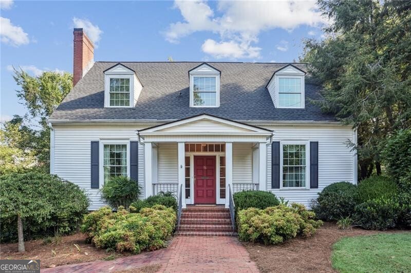 For the first time ever on the market, this captivating Neil Reed designed home offers a rare opportunity to own a piece of Marietta's rich heritage. Beautifully preserved and full of timeless character, this one-of-a-kind residence is just a short stroll from the vibrant shops, restaurants, and events of the beloved Marietta Square. Inside, original hardwood floors run throughout the home, complemented by soaring 10-foot ceilings and elegant architectural details that highlight its charm. The spacious primary suite on the main level offers comfort and convenience, while the second-floor features three generously sized bedrooms and a full bath-perfect for family, guests, or flexible living. The inviting kitchen offers plenty of space to cook, gather, and customize to your style. A grand formal dining room is ideal for entertaining, and the expansive family room with a masonry fireplace creates a cozy, welcoming atmosphere. Just off the living area, a sunroom or den provides a bright and relaxing space for reading, working, or unwinding. The unfinished terrace level presents endless potential-whether for storage, a workshop, or to finish for additional living space. Outside, enjoy a prime location just minutes from top-rated schools, Kennesaw Mountain National Battlefield Park, and all the amenities of downtown Marietta. Whether you're drawn to its charming appeal, exceptional location, or future potential, this home is a truly rare find that must be experienced in person.