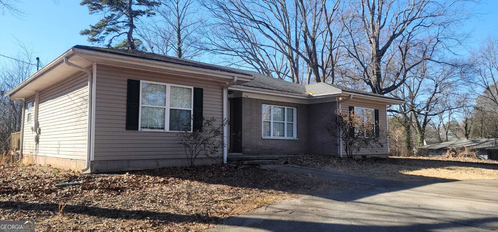 Charming and fully updated 3-bedroom, 2-bath ranch-style home situated on a generous lot in a fantastic location! Move-in ready with brand-new flooring, fresh paint, and modern light fixtures throughout. Highlights include a spacious living room with a cozy masonry fireplace, a bright kitchen with an eat-in dining area, and access to the back deck overlooking a private backyard. This delightful home is perfect for creating lasting memories-don't miss out!
