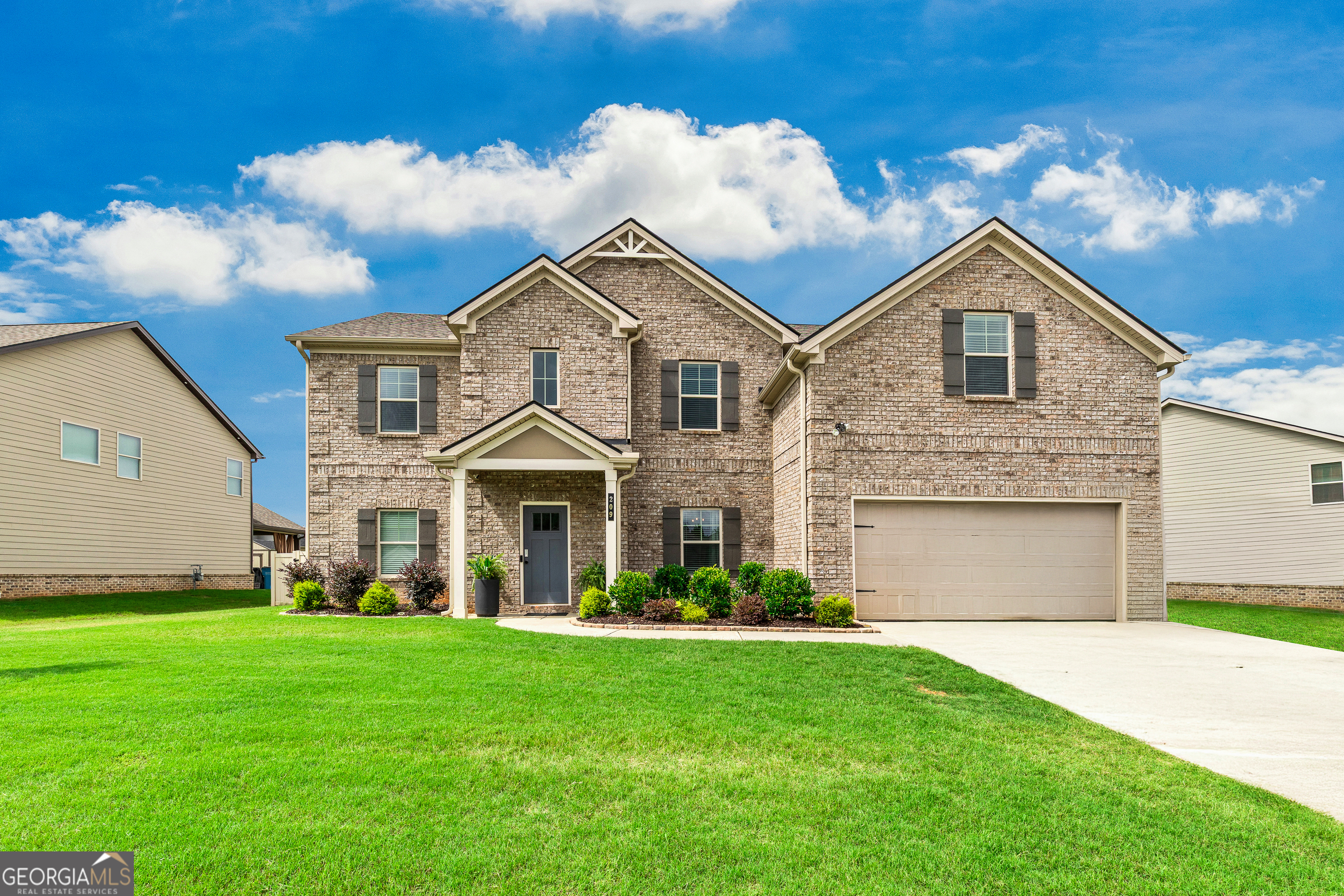 Come see this spacious oasis in McDonough, located in the coveted Union Grove District! With 5 bedrooms, with a separate flex used as a 6th bedroom, everyone has there own space! This beautiful home boasts 2 owners suites making it a great option for multi-generational families. There is a luxurious owner's suite on the main level featuring coffered ceilings and a spa inspired bathroom with free standing tub. Upstairs is a second huge owner's suite featuring a large sitting area as well (so big it is currently being used as a workout room! All equipment will be moved by closing.) Downstairs the upscale kitchen features a large island opening to the spacious living room, perfect for family gatherings and entertaining. The formal dining room (currently used as an office) is a great space for family meals. Take the party outside to the perfect back yard oasis! In-ground pool features a built in hot tub. Enjoy lounging in the shade in one of the 2 covered patio areas! Plus a paved basketball area for some extra fun! The perfect outdoor setting to enjoy grilling out and cooling off with friends and family! The artificial turf adds to the low maintenance features of this home. This could be the perfect home that you have been waiting for, come and see it today!