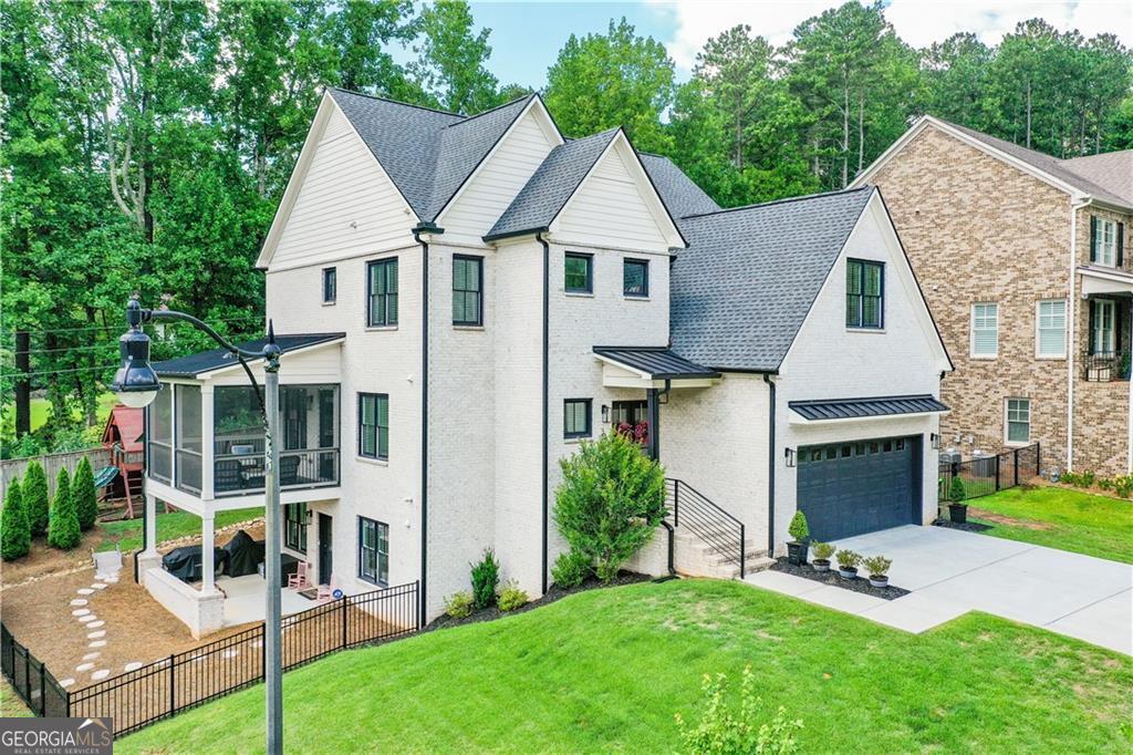 Welcome to your dream home, where modern design meets thoughtful craftsmanship and effortless elegance, nestled within a tranquil 9-home subdivision in the highly sought-after East Cobb location. This stunning 4-bedroom, 4.5-bath residence welcomes you through a covered foyer entrance into an expansive interior boasting 10-foot ceilings on the main level, enhancing the sense of grandeur throughout. At the heart of the home, the spacious white kitchen dazzles with sleek contemporary cabinetry, a custom vent hood, and sophisticated backlighting accents. A grand quartz island, with seating for four, is complemented by high-end stainless-steel appliances, including a wall oven, pot filler, and a 5-burner stove top. Flowing seamlessly from the kitchen, the family room exudes warmth and style, featuring a horizontal digital fireplace and access to a serene, screened porch with tranquil, tree-lined views. The main level offers versatility with a room perfect as an office, playroom, or library. A formal dining area nearby sets the stage for hosting memorable gatherings, while a walk-in pantry and mudroom add practical convenience to the home's stylish design. Upstairs, a wide hallway leads to two generously sized secondary bedrooms, each complete with an en-suite bath and walk-in closet, along with the luxurious primary suite. The primary suite is a true retreat, featuring a spa like bath with a freestanding tub and an expansive frameless glass walk-in shower. A bonus room on this level adds flexibility, ideal as an office or playroom. The finished terrace level is an entertainer's delight or a retreat for guests or teens, offering a private bedroom with a full bath and a vast secondary living area, perfect for a theater room or game space. Step outside to discover a beautifully landscaped backyard, complete with a spacious fenced yard for privacy and versatility. The yard also features a stylish covered patio, providing a perfect space for outdoor dining, relaxation, or year-round enjoyment while embracing the beauty of your surroundings. This outdoor haven perfectly complements the home's charm, creating an idyllic retreat for your lifestyle. Neighborhood has no Swim/tennis, but owners joined nearby East Cobb Swim & Tennis for $550.00/yr-great optional amenity!
