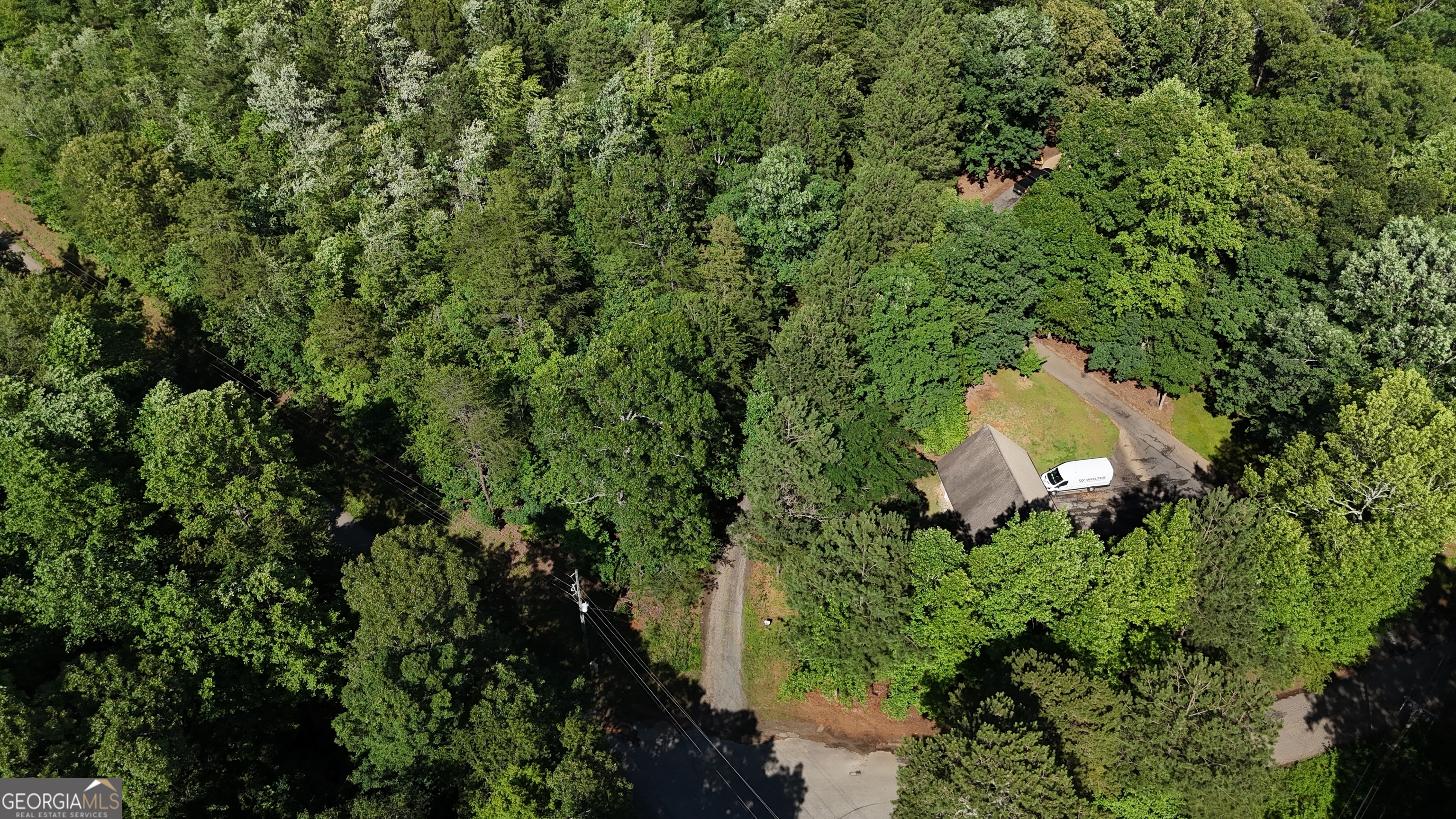 Discover the perfect spot to bring your dream home to life! This 4.81 acre lot offers a private drive leading to a secluded and serene building site, ready for your custom plans. With no HOA restrictions, you'll enjoy the freedom to build the way you want. Conveniently located near schools, shopping, and local amenities, this property combines peaceful privacy with everyday convenience. Don't miss the chance to create your own retreat in this highly desirable location!