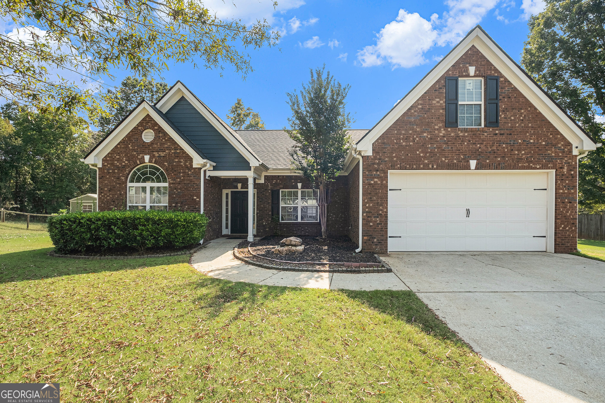 Exceptional value-spacious 4-bedroom ranch priced well below comparable homes! This sought-after brick-front home includes a separate office or living room, blending comfort with functionality. The foyer and dining room feature beautiful hardwood floors, while the vaulted ceiling in the great room and trey ceiling in the primary suite add a touch of elegance. Upstairs, the fourth bedroom/bonus room with closet makes an ideal teen suite, craft space, man cave, or private guest retreat. The primary bath offers dual sinks, a jetted tub, and a separate shower. Recently inspected and found to be in excellent condition, with the septic just pumped and a clearance letter provided. Home also comes with a full one-year warranty for added peace of mind. Outside, enjoy a huge, fenced, and private backyard with an outbuilding perfect for lawn equipment or extra storage. Move-in ready with no HOA-schedule your showing today before it's gone!