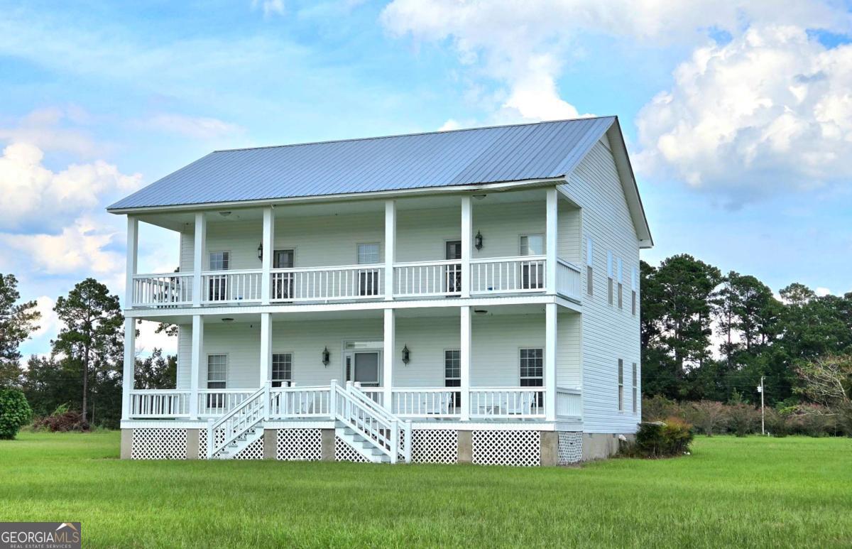 Welcome to an AMAZING new listing! 2,464 square foot, 2 story home with a beautiful view! Across the road theres an additional 3 bedroom, 2 bath dwelling also offered on the 24.12 acre parcel. The unique stick built home with a metal roof was constructed in 2014. Built to embody the character of an old farm house, it has all the conveniences of a new home! Fabulous foyer with an antique kerosene light fixture! It has 3 spacious bedrooms and 3 full bathrooms, a formal living room, den/office, and formal dining room. Solid wood cabinets, great counter space, a wood burning buck stove and tons of natural light flood the kitchen. The fancy dining room is large enough to host Thanksgiving & Christmas dinners! The study has custom built ins for all your books and pictures. The home was constructed with outdoor living space on the front and back- Upstairs bedrooms give access to the front of the home on the upper level porch and downstairs to the front porch and deck out back. LOTS TO LOVE!