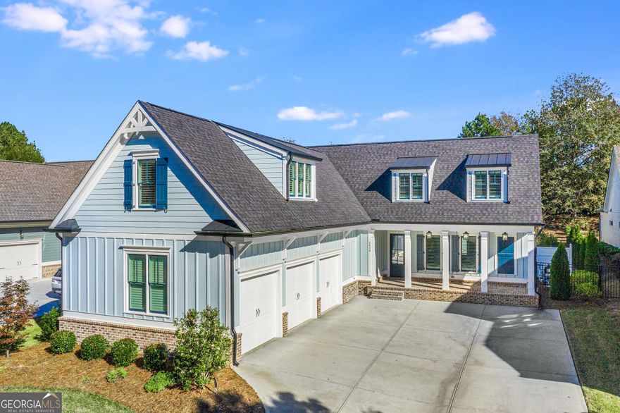 This stunning property in the prestigious Oconee Springs section of The Georgia Club epitomizes luxury and timeless charm. Perfectly situated across from the community's beautiful common area, the home offers a picturesque view of the greenspace, creating a private and serene setting from the front porch-the ideal spot to unwind and take in the tranquil surroundings. It features five spacious bedrooms, each with its own ensuite bathroom, ensuring privacy and comfort for all residents. The home is designed with a 3-car garage and a charming rocking chair front porch, exuding a welcoming atmosphere. As you step through the front door, you will be instantly captivated by the courtyard that serves as a private oasis, featuring an innovative pool and raised spa perfect for ultimate relaxation. Once inside the home, you will notice the kitchen is a culinary haven, a true testament to both functionality and style. The space is designed to inspire creativity, featuring commercial-grade Thermador appliances that cater to both amateur and professional chefs alike! A striking contrast is created between the black leathered countertops around the range and the gleaming white quartz island which takes center stage, inviting guests to gather around and partake in the culinary magic! The functional working pantry is a game-changer, offering a dedicated space to keep small appliances out of sight yet easily accessible! Whether you're preparing a simple meal or hosting a gourmet feast, this kitchen is the perfect backdrop for all your culinary adventures. The sophisticated dining area flows seamlessly into the Family Room which exudes a sense of cozy comfort with its inviting warm fireplace as the focal point and detailed ceiling with shiplap and beams. The well-designed Family Room perfectly integrates into a covered porch and private backyard creating a harmonious indoor-outdoor living experience. The main floor owners' suite is a luxurious retreat with a beautifully designed bathroom, featuring a freestanding soaking tub, frameless shower with rainfall showerhead, and his and hers vanities with custom cabinetry. French doors elegantly open the spacious bedroom to the tranquil courtyard, where the gentle sound of water from the pool creates a serene escape. The brilliant design choice of incorporating "His" and "Her" closets with custom closet systems that connect directly to the main laundry room enhances both functionality and convenience. The privately located guest suite on the main floor provides a serene retreat for visitors, ensuring their stay is comfortable and enjoyable. Adding to the home's appeal, the gorgeous powder room offers a touch of elegance with its vessel sink and brick tile wall. The practical mudroom, situated off the garage, serves as a versatile space for organizing coats, shoes, and other essentials, keeping the rest of the home tidy and clutter-free. The upstairs area of this home is designed with both convenience and luxury in mind. The inclusion of its own laundry room means no more hauling clothes up and down stairs, making laundry day a breeze! The two ensuite bedrooms provide a retreat for each occupant, complete with their own bathrooms for added comfort and privacy! Furthermore, the expansive loft, equipped with built-in desks, serves as a versatile space perfect for work, study, or creative pursuits, blending productivity with the coziness of home! Additional highlights include ten-foot ceilings on the main level, custom closet systems, and glass doors on all tubs. The detached fifth bedroom offers versatility as a guest suite or private office space, with separate bathroom access to the pool area. Situated in a highly desirable location, this home offers an exceptional blend of elegance and practicality, enhanced by the award-winning Oconee County School System. A MUST SEE!!! (Lawn Maintenance $586 quarterly).