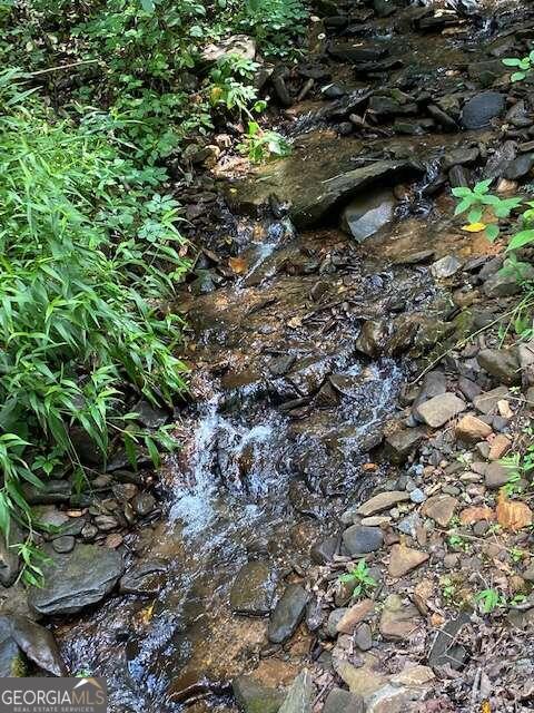 Fantastic Pristine Property with a Stunning Waterfall and Creek frontage going through the property. Mountain Views and Lots of Elbow Room. This Property Has It All. Road cut into views & looks over the Waterfall and Creek. Follow road up and into property. Great for Development or Personal Space.