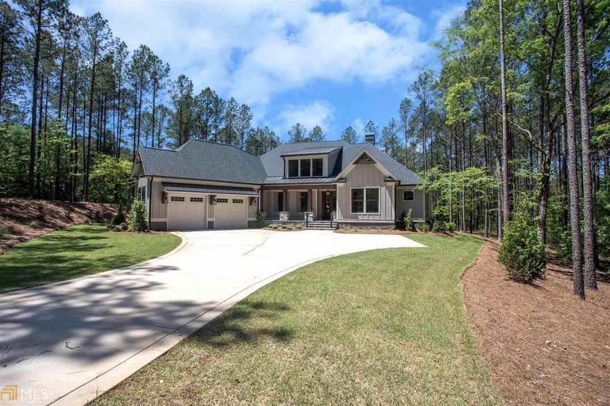 Beautiful NEW constructed home just completed in sought after Reynolds Lake Oconee! Built by New Leaf Custom Homes and known for their attention to detail. This OPEN CONCEPT 5 bedroom/4 bath home with vaulted beamed ceilings, gas fireplace and tons of windows flows effortlessly into the beautiful CHEFS KITCHEN. The owner's suite is located on the main level with a ship-lapped tray ceiling, walk-in closet, beautiful spa like bath with soaking tub and oversized shower and the place your buyer will hide-away in. The bonus room/5th bedroom is located upstairs with an en-suite bath. Located away from the main living space, are two bedrooms with a Jack-n-Jill bath. Some appointments offered are, Quartz counter-tops, Stainless Steel appliances, refrigerator included, “48” Wolf gas double oven/range, stove pot-filler, drawer style microwave, back-lit cabinets, beverage center with refrigerator/bottle storage, hardwood floors, ceiling fans in all bedrooms, water softener system and a 120-gallon propane tank.  The covered ENTERTAINMENT PATIO has vaulted wood ceilings and a flagstone deck with a propane hook-up for grilling. This perfectly designed home is conveniently located to all the community has to offer from shopping to golf and more. Seller is making a Golf Level Membership available.
