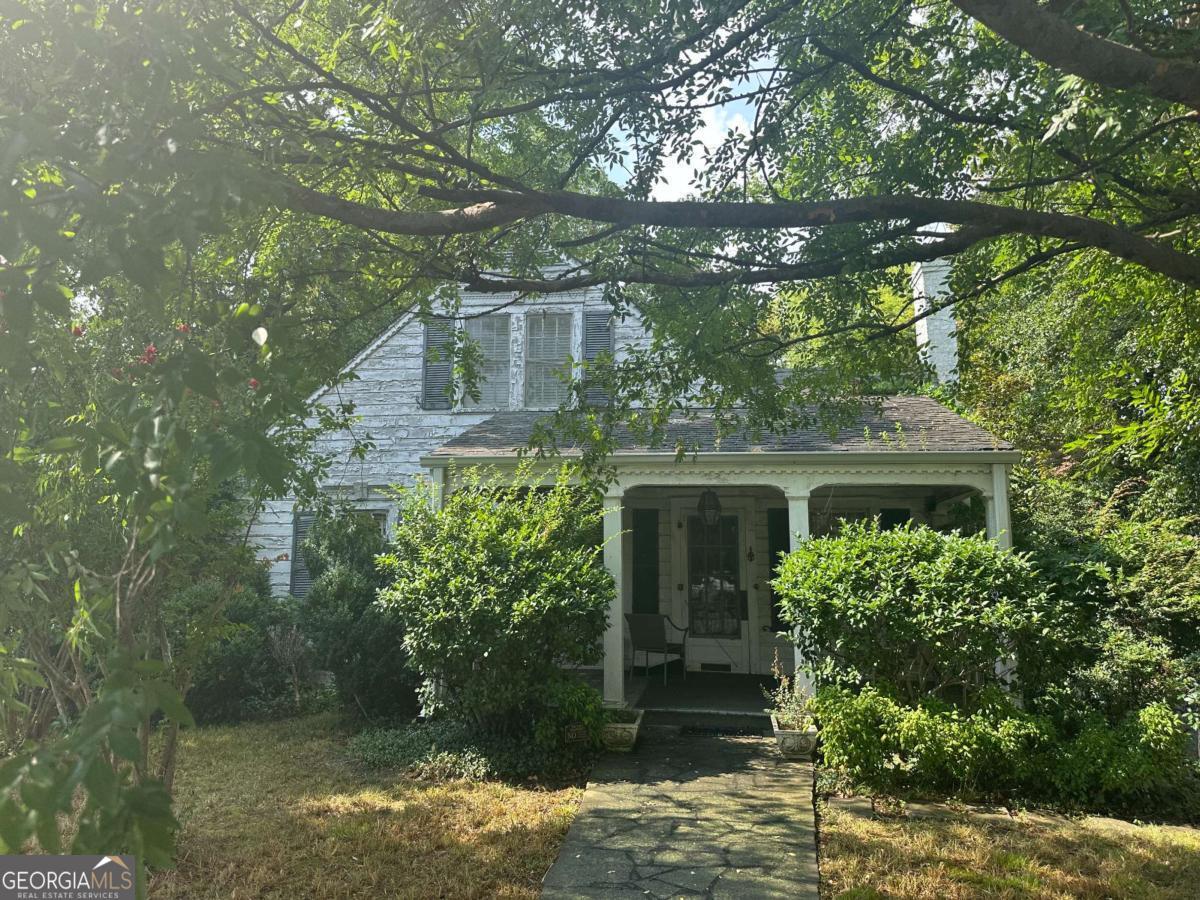INVESTOR GEM! This could be your diamond in the rough in downtown Cartersville. Offering 3 BR / 1 BA with amazing bones, the interior walls are original, it has hardwood floors, a separate dining room and living room. Upstairs has a bedroom that could adjoin a sitting room/office. Tons of potential is offered for this home with some rehab work. Will be active for showings Friday, August 1, 2025 and all offers are due prior to Monday, August 4th at 5 pm EST.