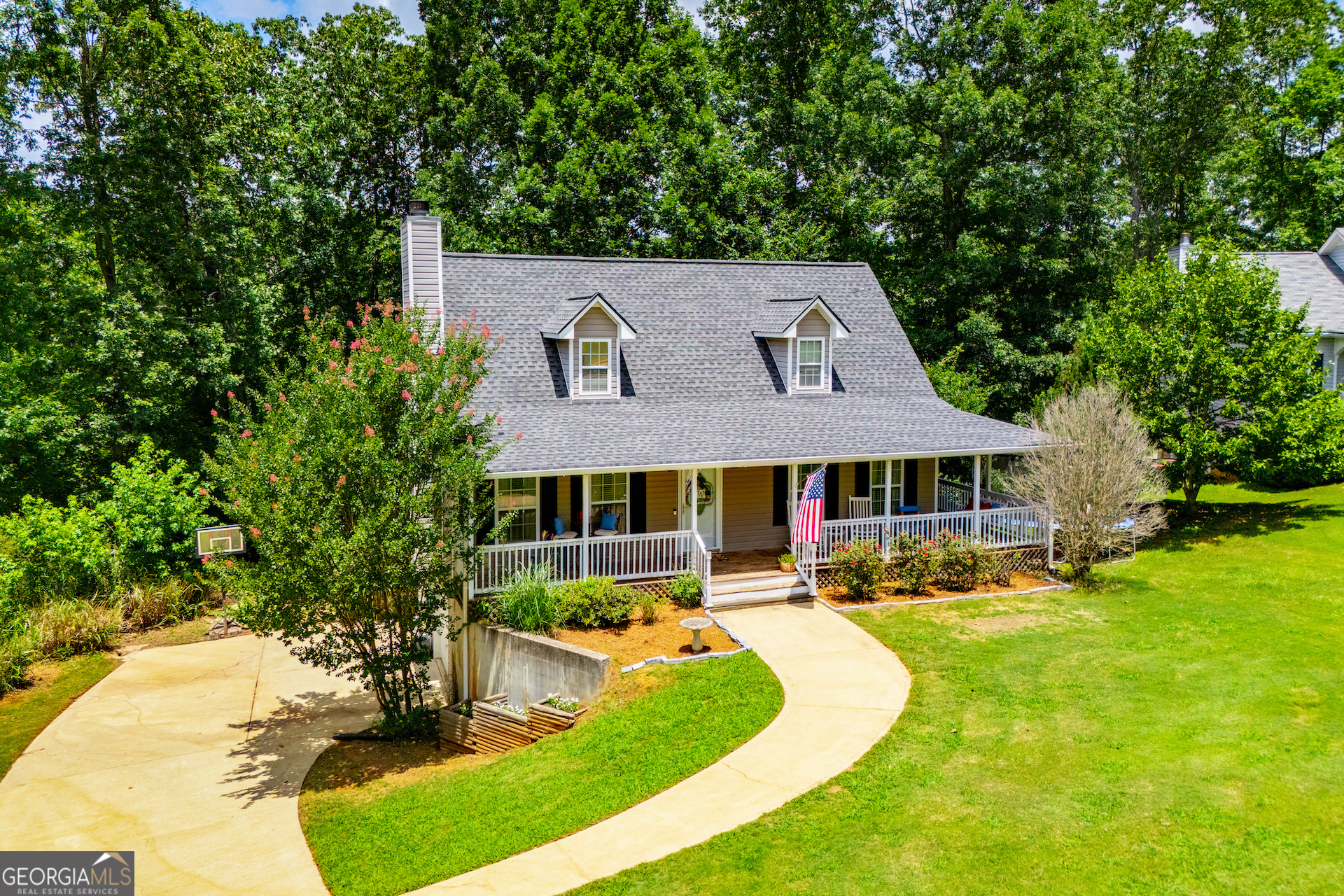 Charming and Immaculate Home with Inviting Wrap-around Porch! This beautifully maintained home exudes charm and comfort, starting with a welcoming wraparound rocking chair front porch-perfect for relaxing or entertaining. Inside, you'll find a light-filled open family room featuring a stacked stone fireplace. The main-level primary suite provides private access to the covered porch and includes a spacious en-suite bath with dual vanities, a separate tub and shower, and ample closet space. Additional highlights include a half bath, a large laundry room, and generously sized guest bedrooms upstairs, each with large closets! The full basement includes a two-car garage, abundant storage, and a finished bonus room-perfect for a home office, gym, or media space (Currently being used as a home gym!) This home is situated perfectly on a quiet cul-de-sac lot, is in excellent condition, and ready for its next chapter. Also, includes a brand NEW back deck!! *** Seller offering a $3,000 carpet allowance with acceptable offer!*** ALSO, the roof is only 6 years old and the HVAC was fully replaced 2-3 years ago!