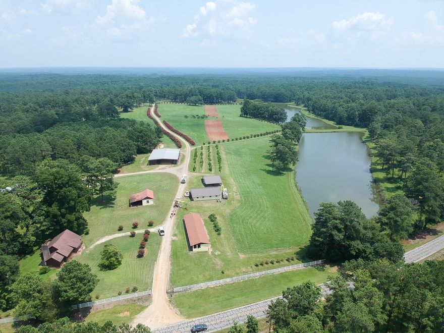 Circle N Farm, which consists of approximately 3,950 acres located in east-central Alabama. Circle N Farm has a nostalgic feeling when you pass through the main entrance. It takes you back to a simpler time when farming and raising cattle was the job of the day. The late afternoons and weekends were enjoyed with family and friends while running bird dogs or shooting dove. The Farm has several buildings, from the caretakers' house, dog kennels, a large iron-framed pole barn, and a few other specialty buildings, just to mention a few. And for those overnight guests, follow the long driveway lined with majestic crepe myrtles to the 2600 sqft lodge with five bedrooms, two bathrooms, and a large screened wrap-around porch that overlooks the larger of the three trophy ponds. After a successful day of hunting, the large wood-burning fireplace in the lodge offers a cozy place to tell stories of the day's hunt. For those wing shooters, Circle N offers an eight-stand skeet range to help perfect your shooting skills. With miles of improved roads throughout Circle N Farm, one could explore for hours. If you're looking for a truly unique wildlife preserve with timber income for generations to come, look no further than Circle N farm. Listed in partnership with SVN Saunders Ralston Dantzler. Call today to schedule your appointment and experience Circle N Farm.